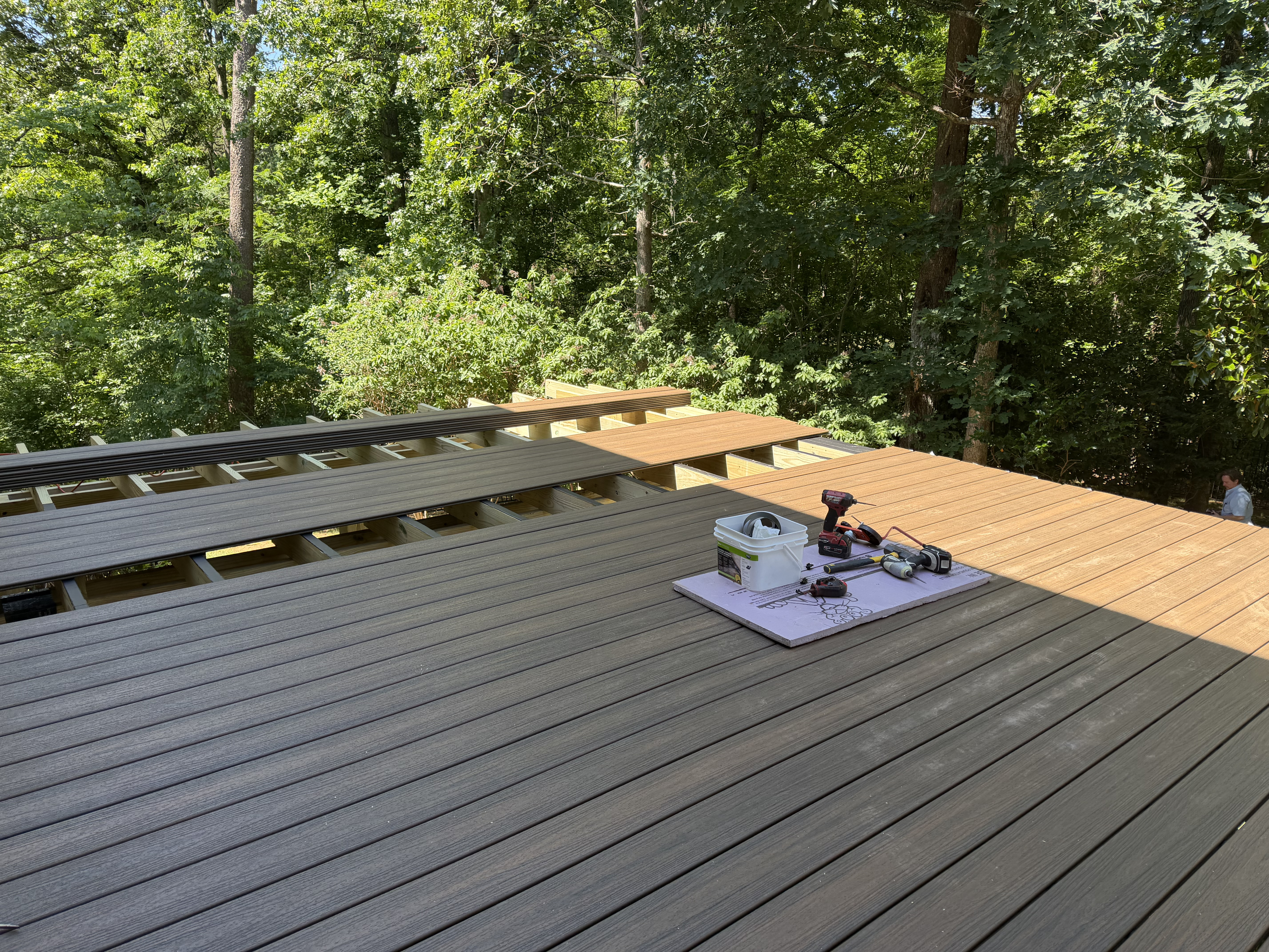 Composite decking being installed during the Campos deck project