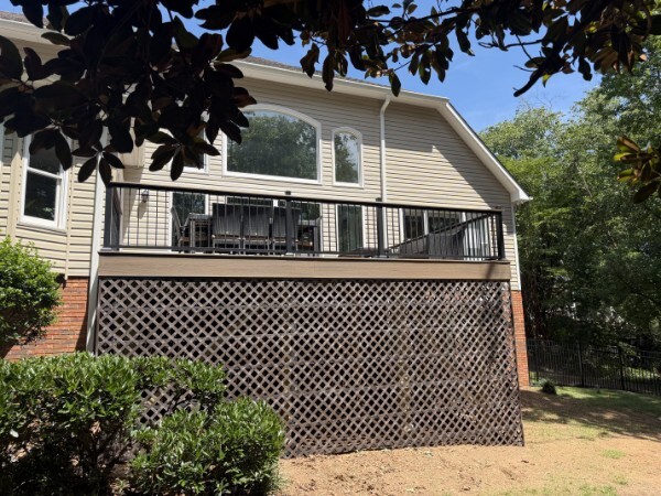 Finished composite deck with black aluminum railing in Taylors, South Carolina
