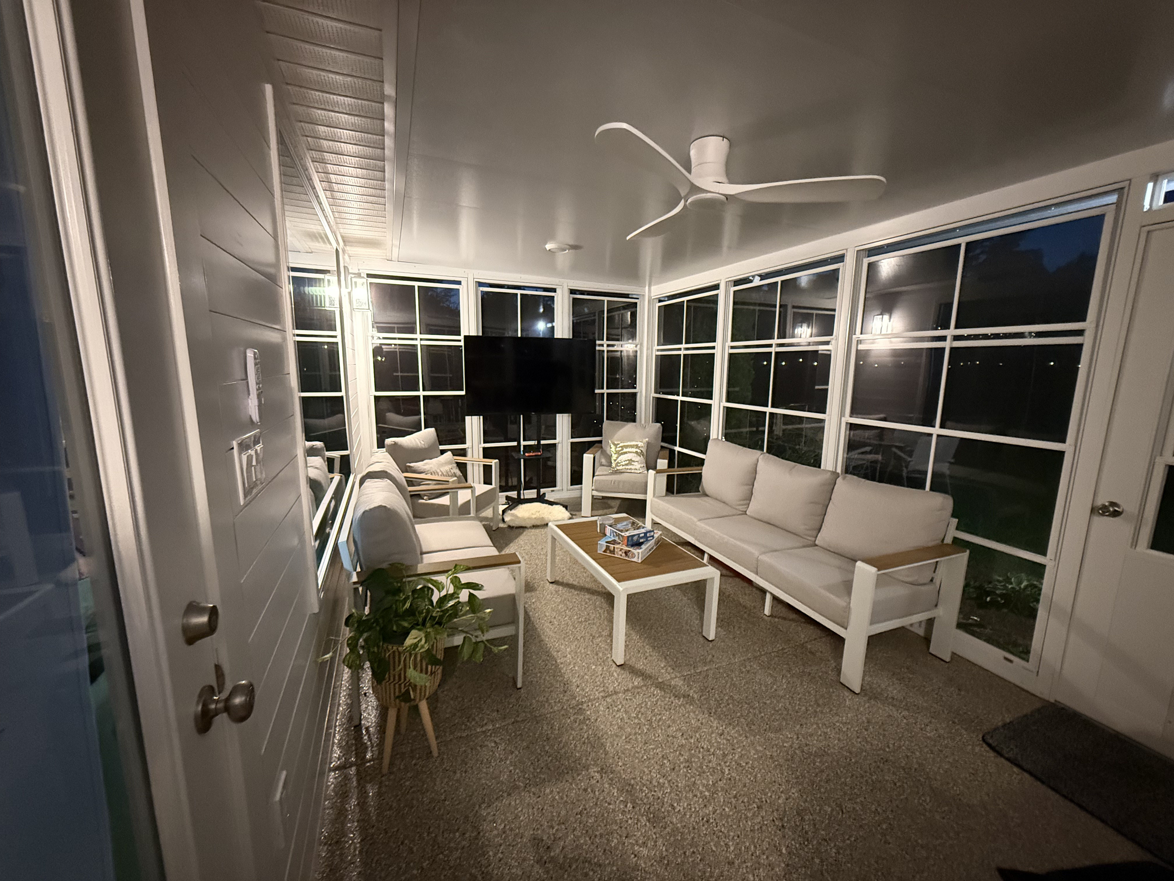 Hill Eze-Breeze outdoor room illuminated for evening use