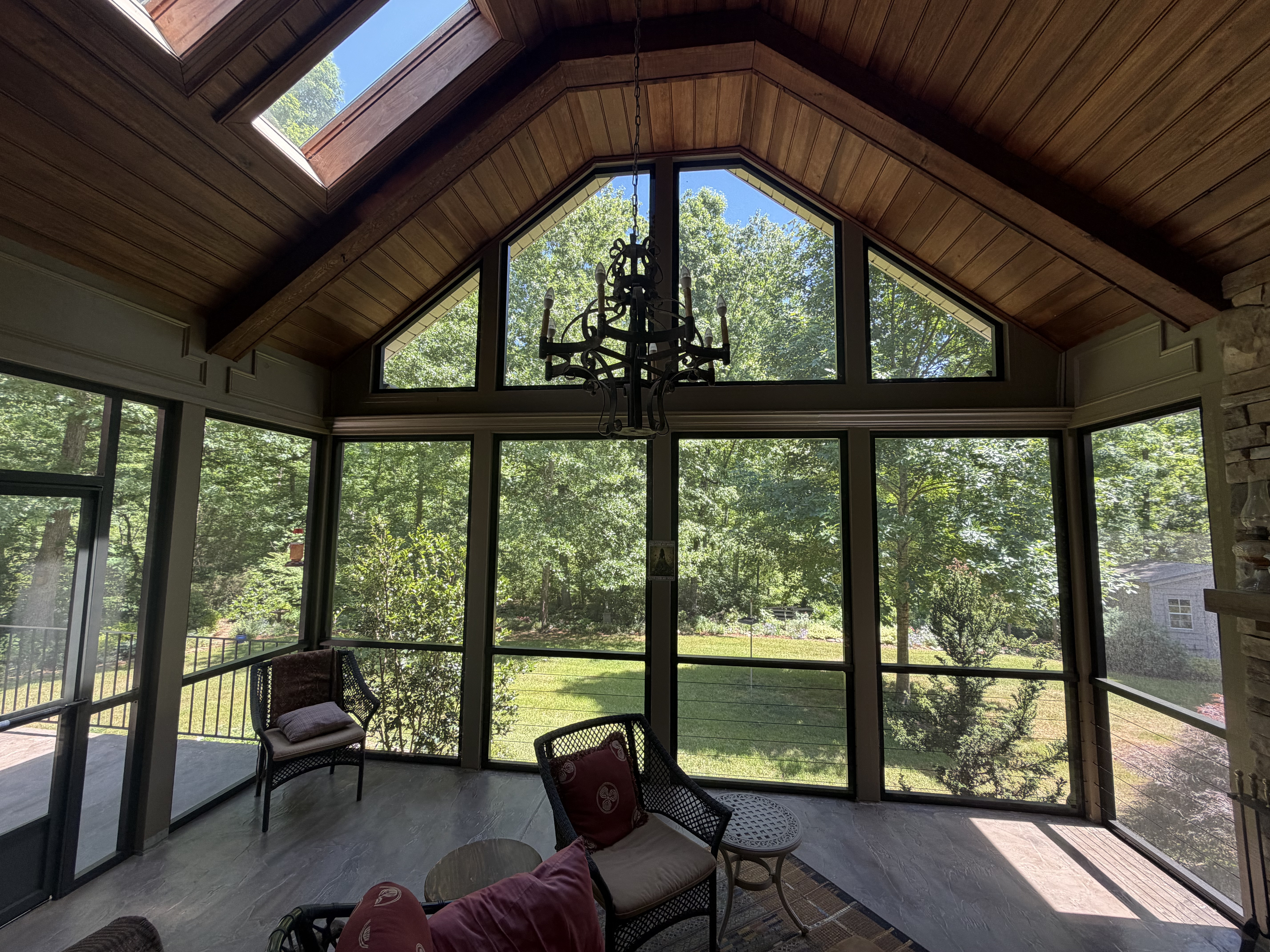 Renovated screen porch with vaulted wood ceiling and open views in the Paris Mountain area of Greenville