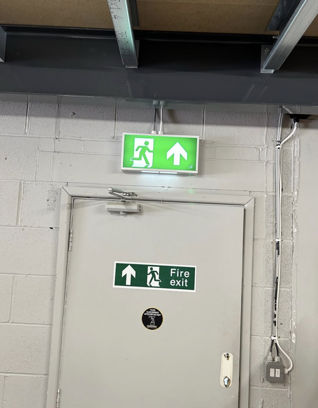 Illuminated fire exit signage by J P Slater Electrical in Preston