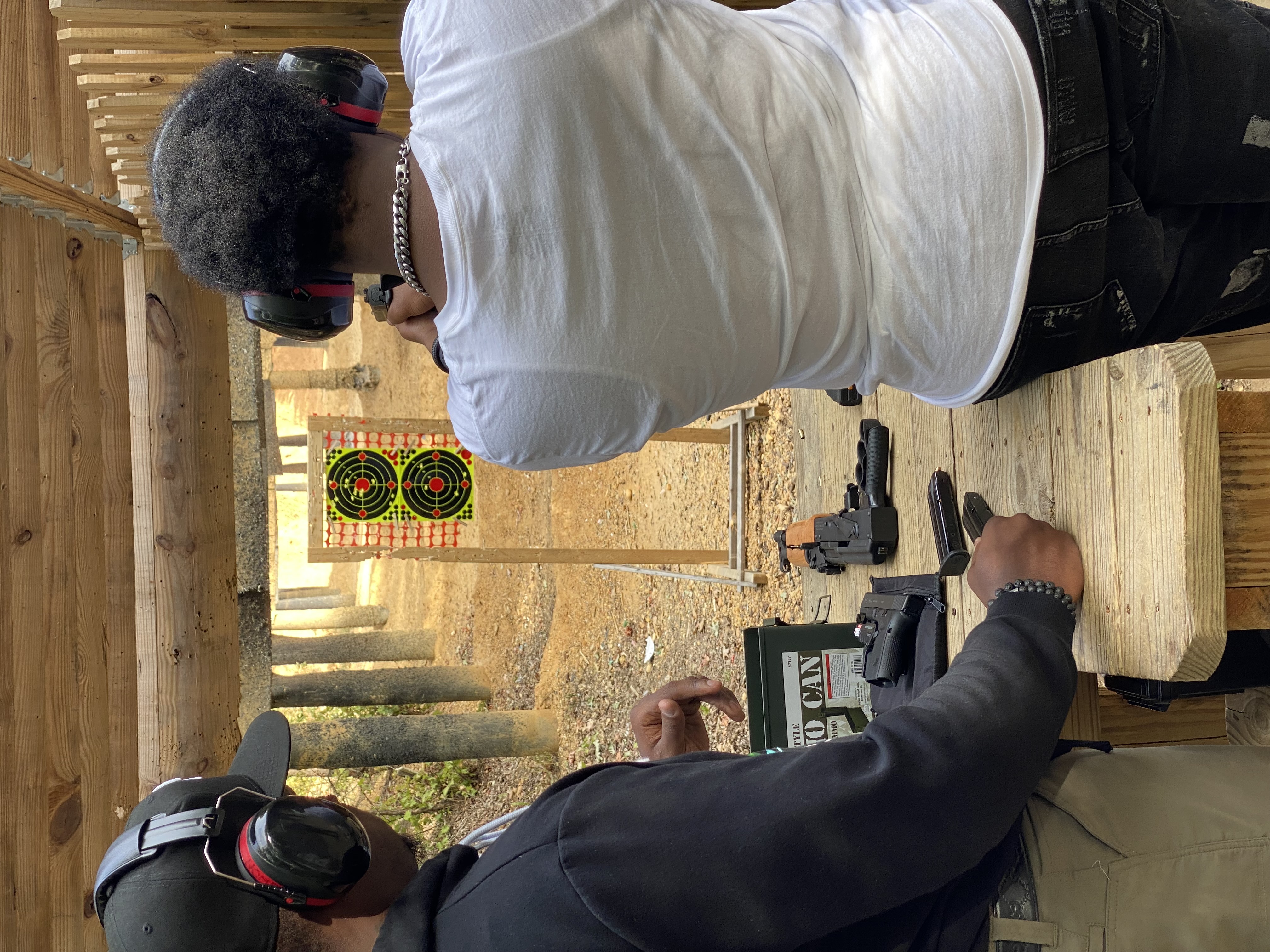 Clifford Hearst coaching a student during live-fire range training