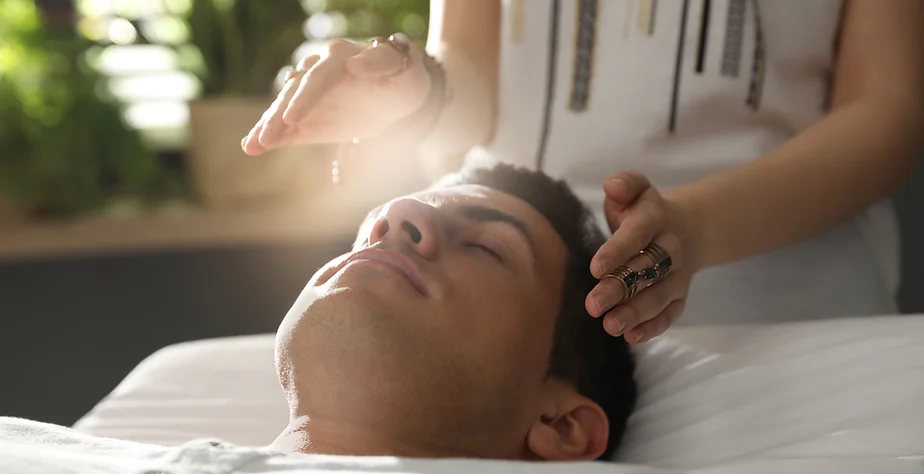 Man Having Reiki Performed On Him