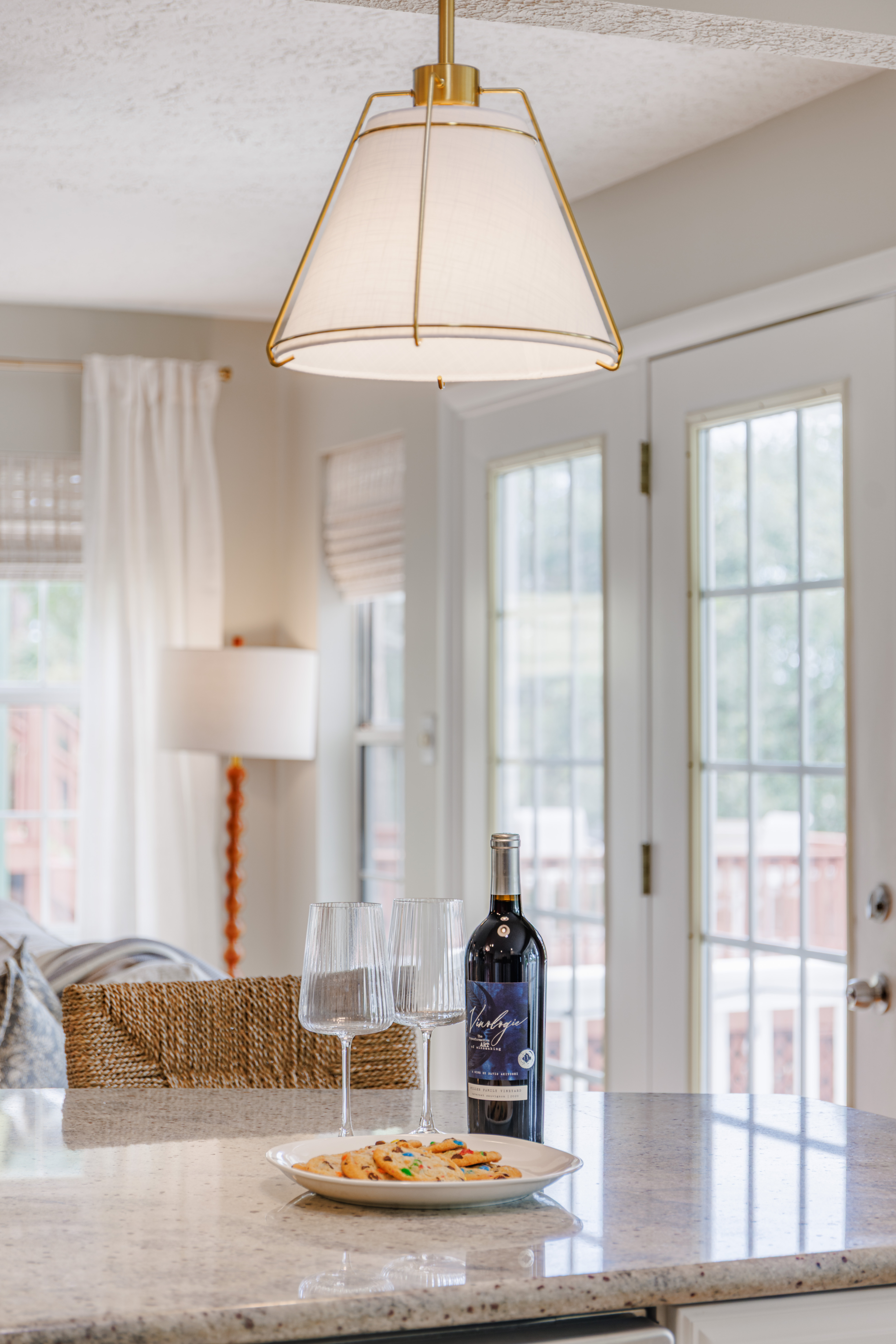 The Retreat at San Marco — living room detail with throw pillows, woven textures and collected coastal accents