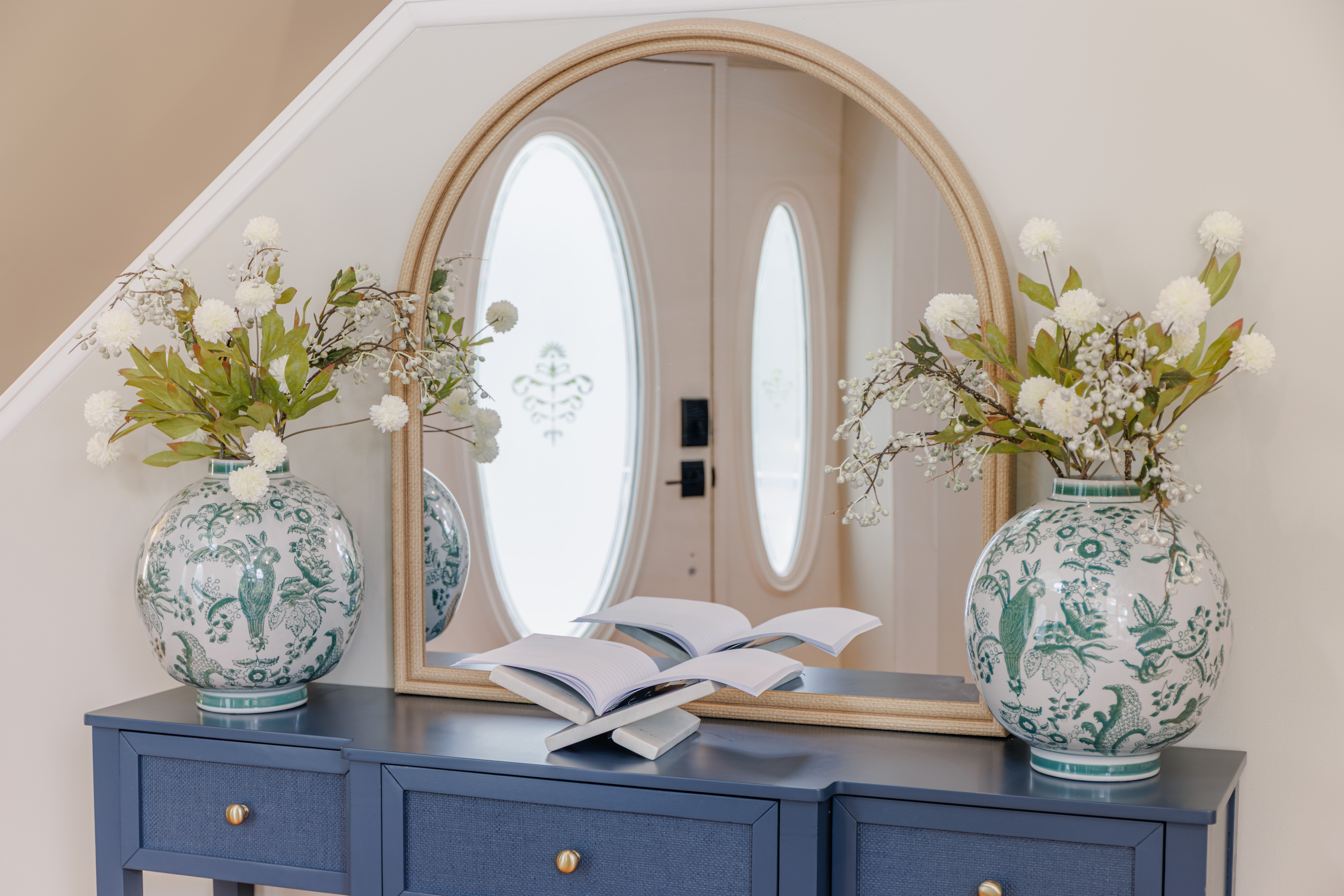 The Retreat at San Marco — bedroom with plush bedding, bedside styling and soft natural light in a Tybee Island vacation rental