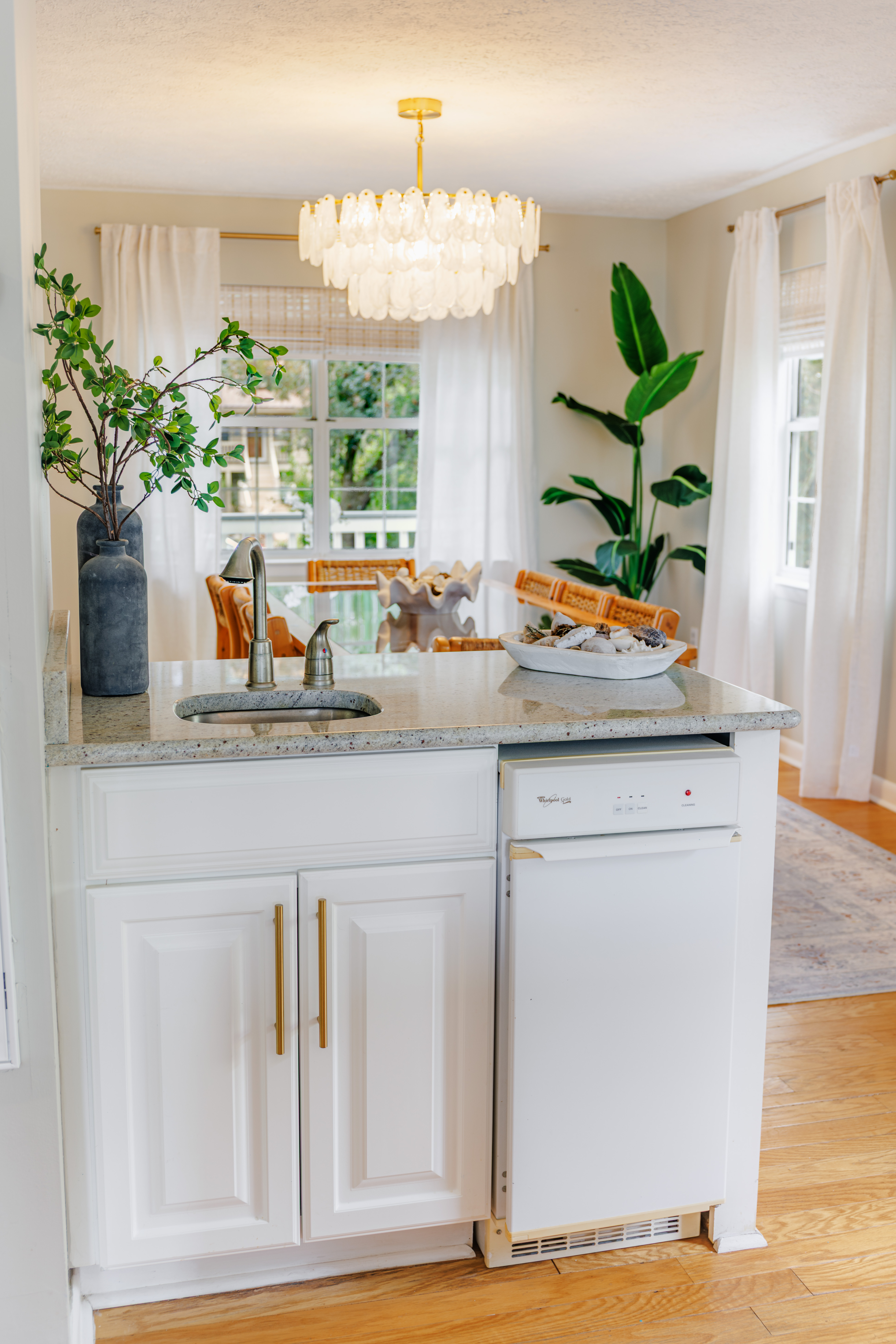 The Retreat at San Marco — styled entry and seating area with layered coastal décor and curated artwork in a Tybee Island vacation rental
