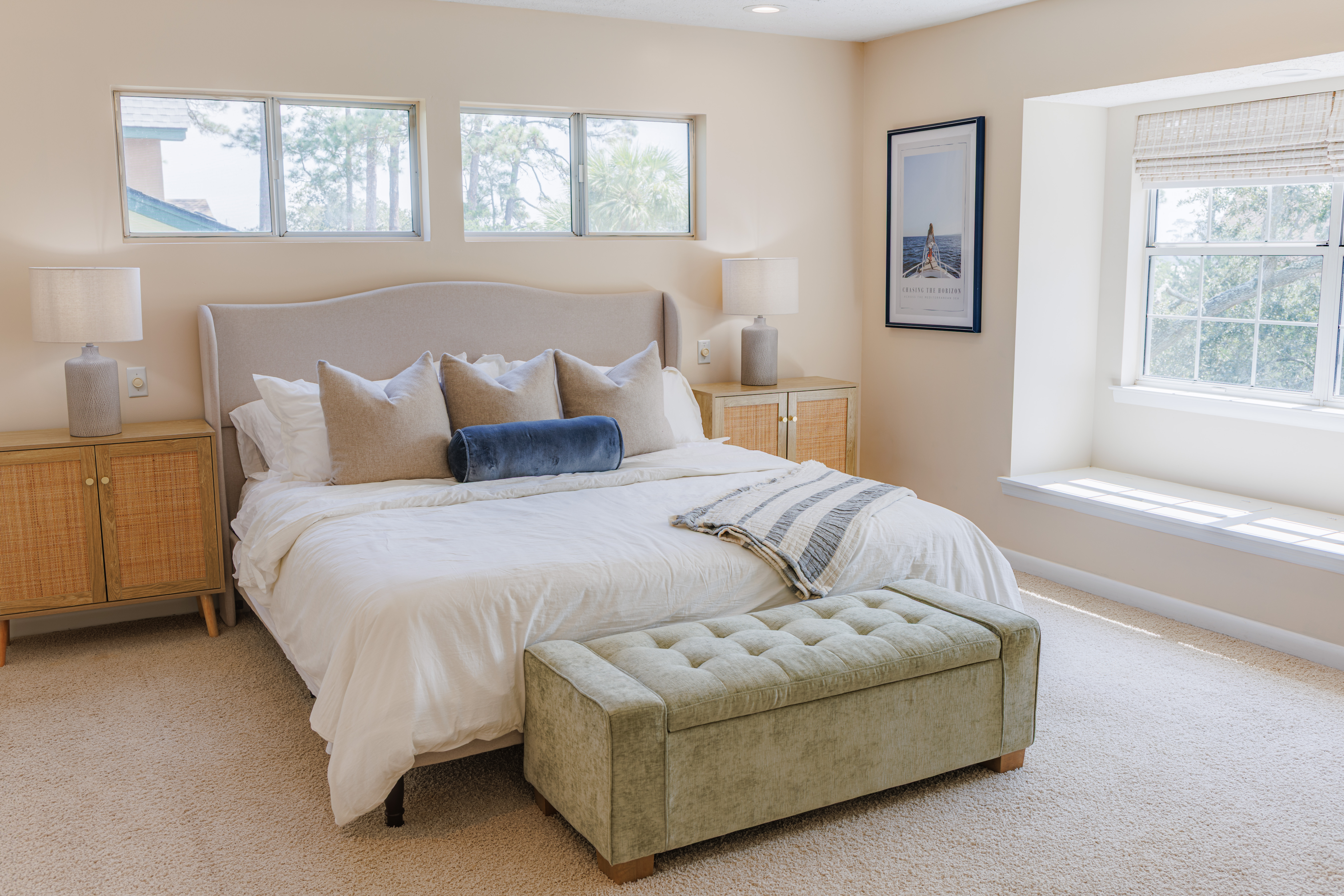 The Retreat at San Marco — cozy styled reading nook with layered textiles and coastal artwork in a Tybee Island vacation rental