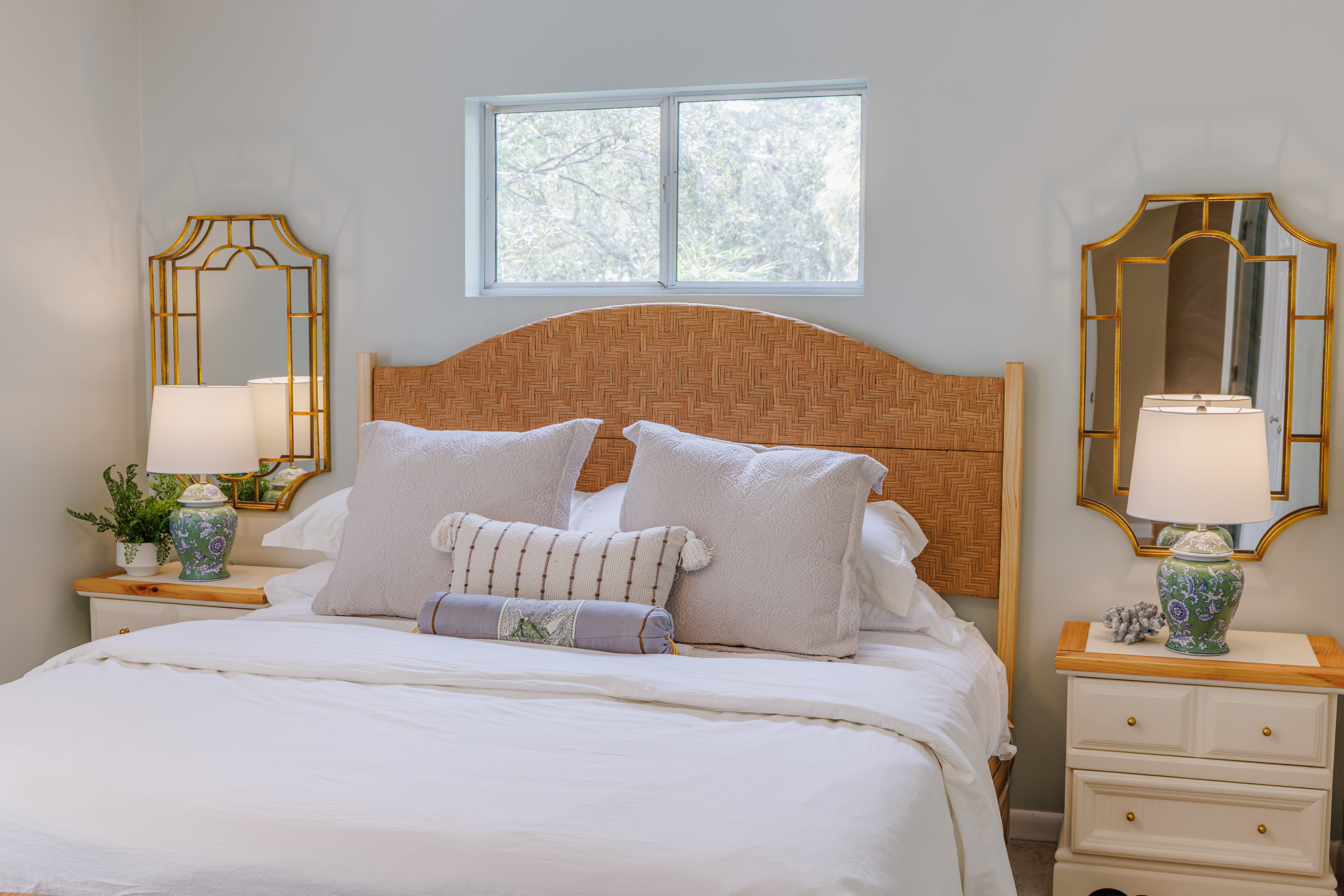 The Retreat at San Marco — living area detail with layered textures, throw pillows and curated coastal accents