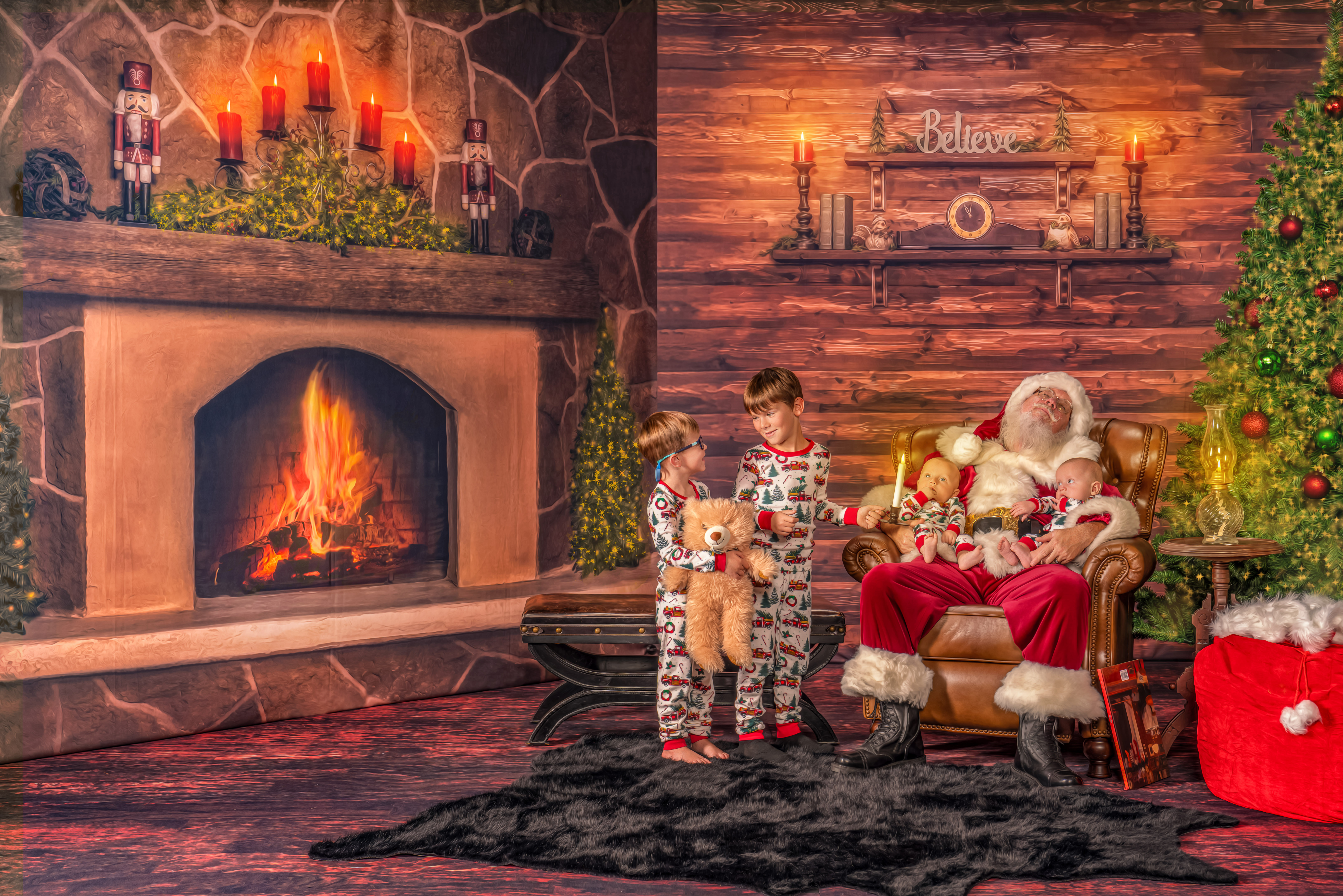 Santa Chris is sleeping with the babies and the older brothers are trying to wake him during The Magic of Santa experience