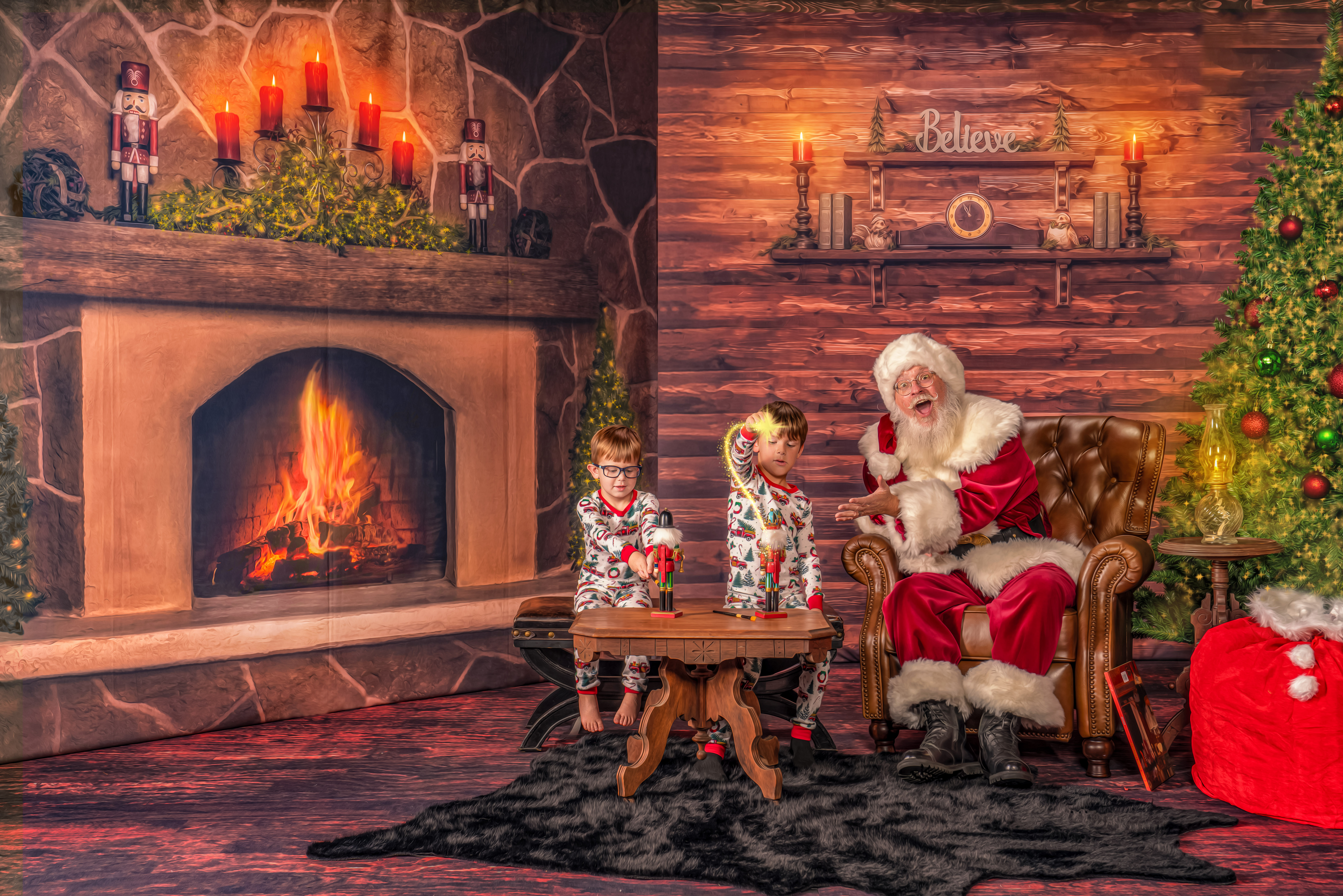 Santa Chris helps the children with their magic while making toys for Christmas celebrating during The Magic of Santa portrait experience
