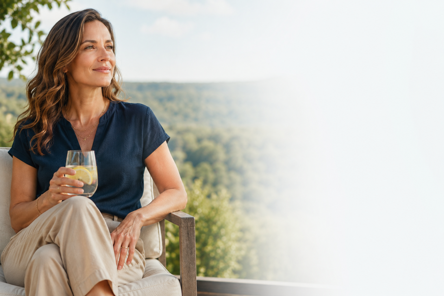 Woman enjoying a peaceful outdoor moment with lemon water