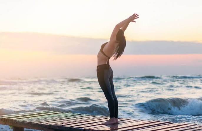 Yoga teacher mid-practice