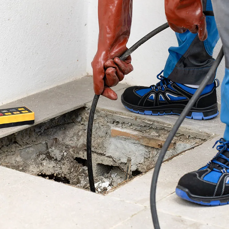 Plumber performing camera inspection of main sewer line in Puyallup, WA.