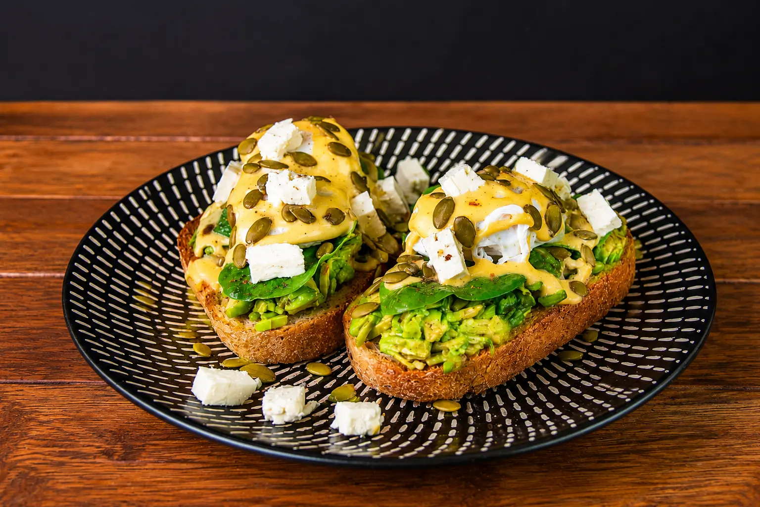 Smashed avocado with poached eggs, feta and hollandaise from Coffee & Dreams on Gouger Street, Adelaide.