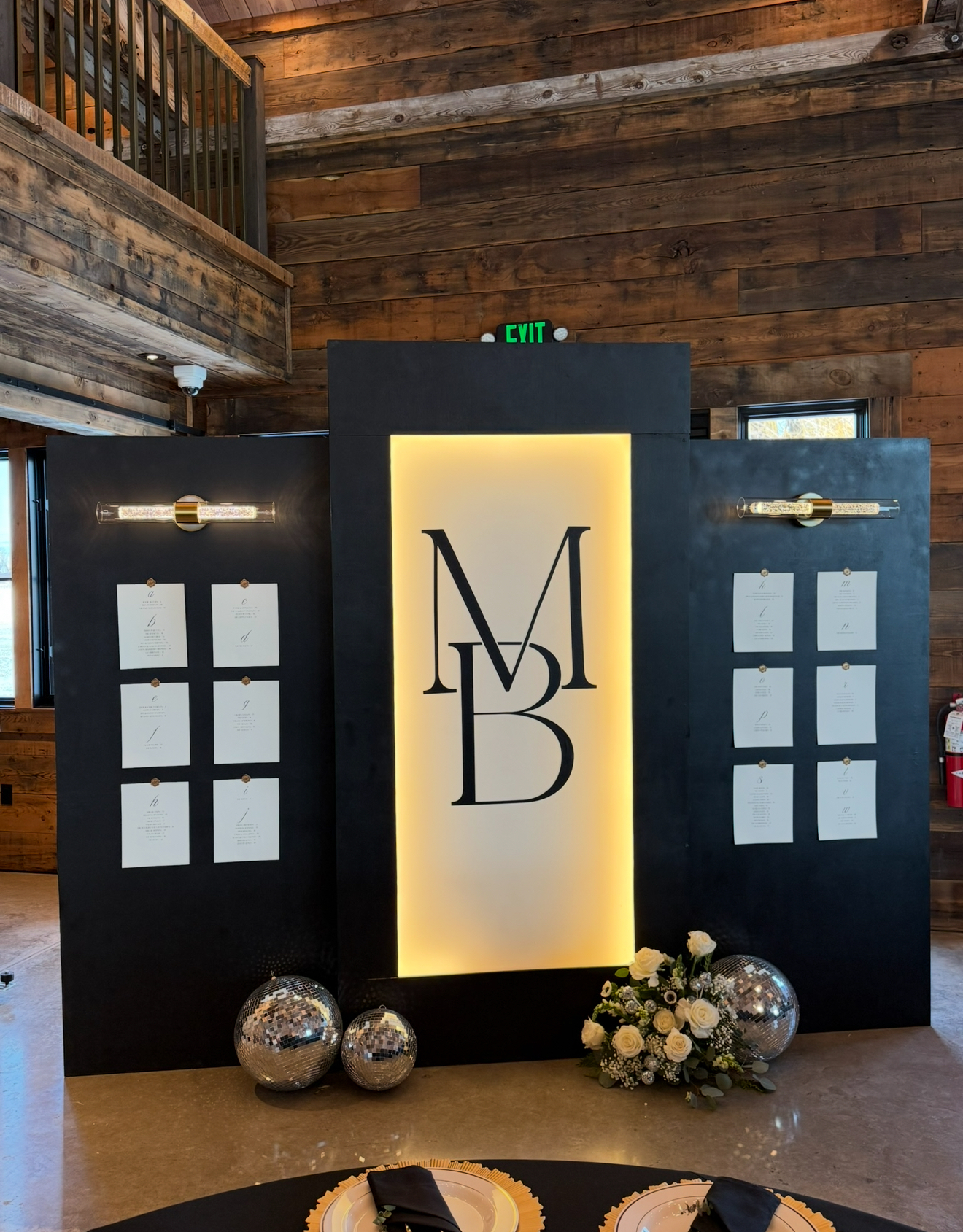 The backlit wedding seating chart, lit at the reception