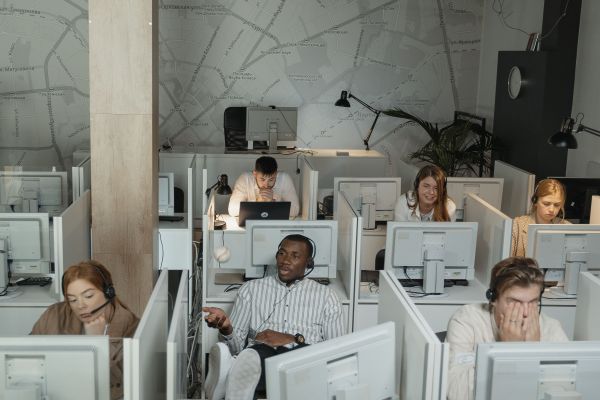 call center with people working in tiny cubicles
