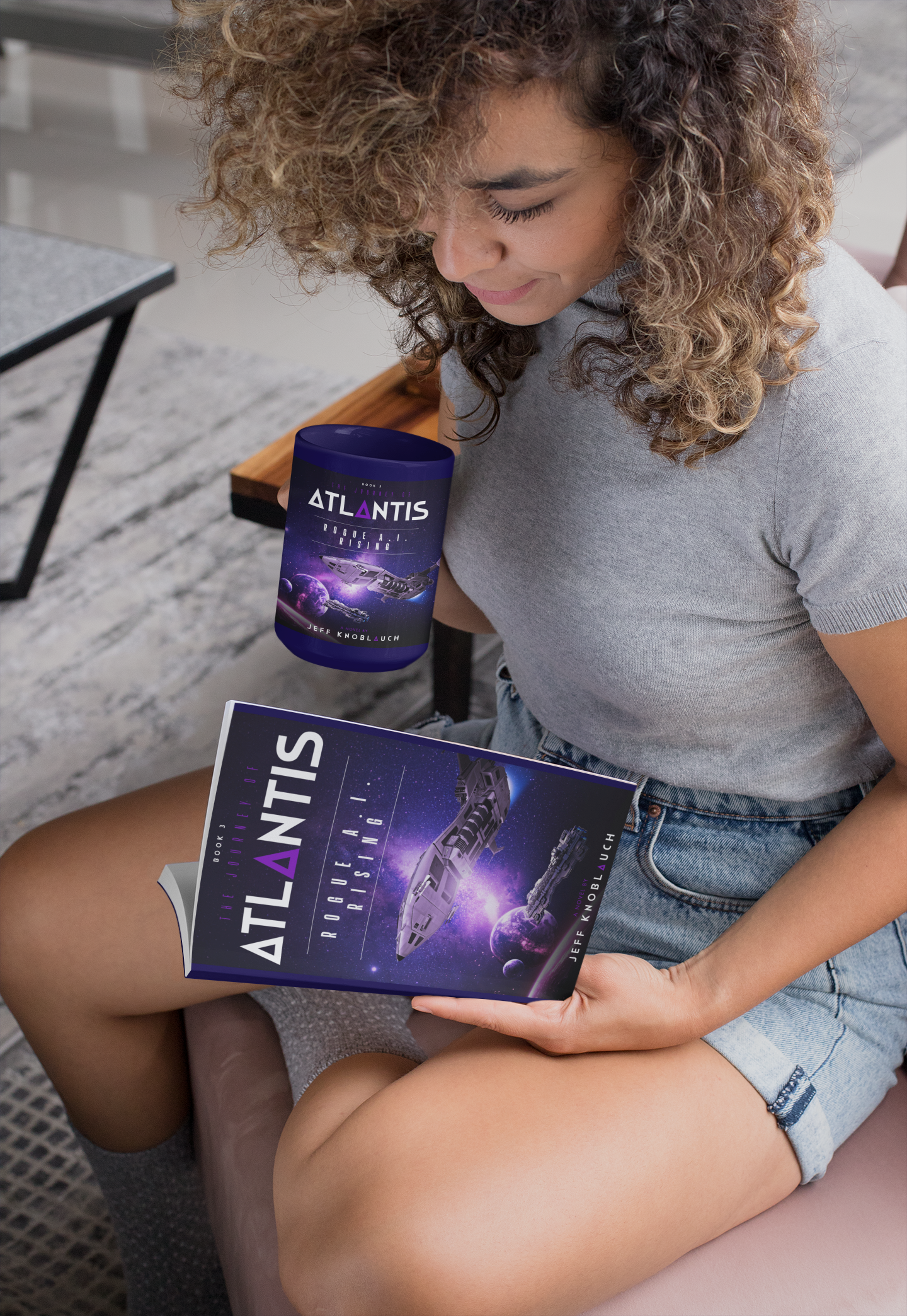 Picture of a woman reading Atlantis: Rogue AI Rising by Jeff Knoblauch and holding a Rogue AI Rising coffee cup Picture of a woman reading Atlantis: Rogue AI Rising by Jeff Knoblauch and holding a Rogue AI Rising coffee cup