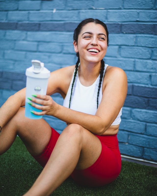 happy healthy woman enjoying a break while exercising happy healthy woman enjoying a break while exercising