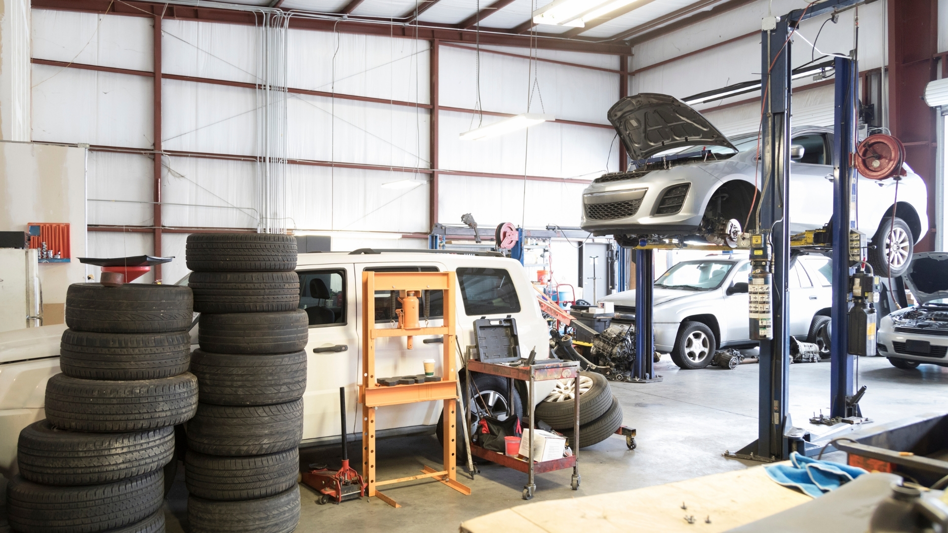 Auto body shop owner reviewing repair operations