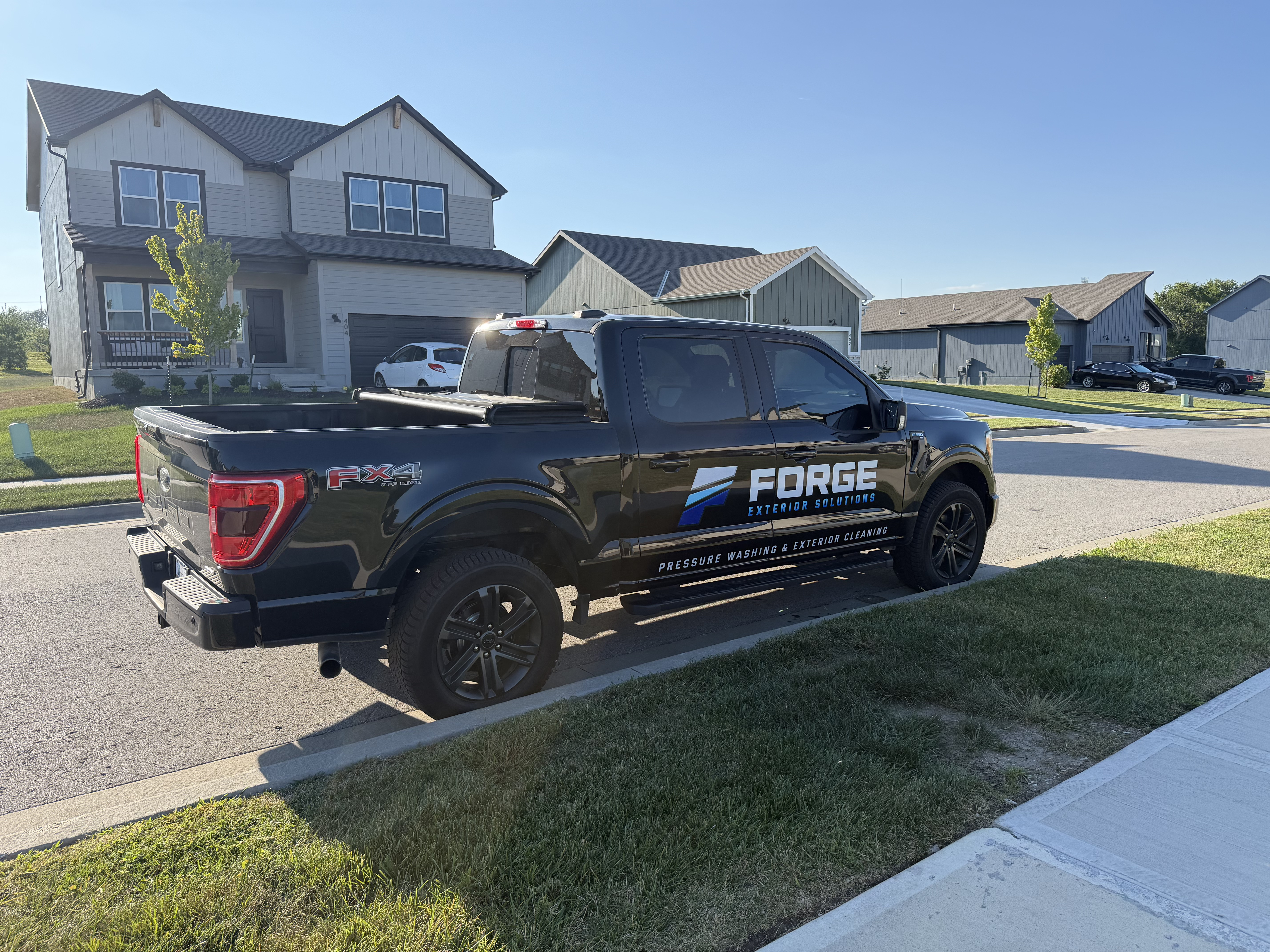 Forge Exterior Solutions equipment loaded on the trailer