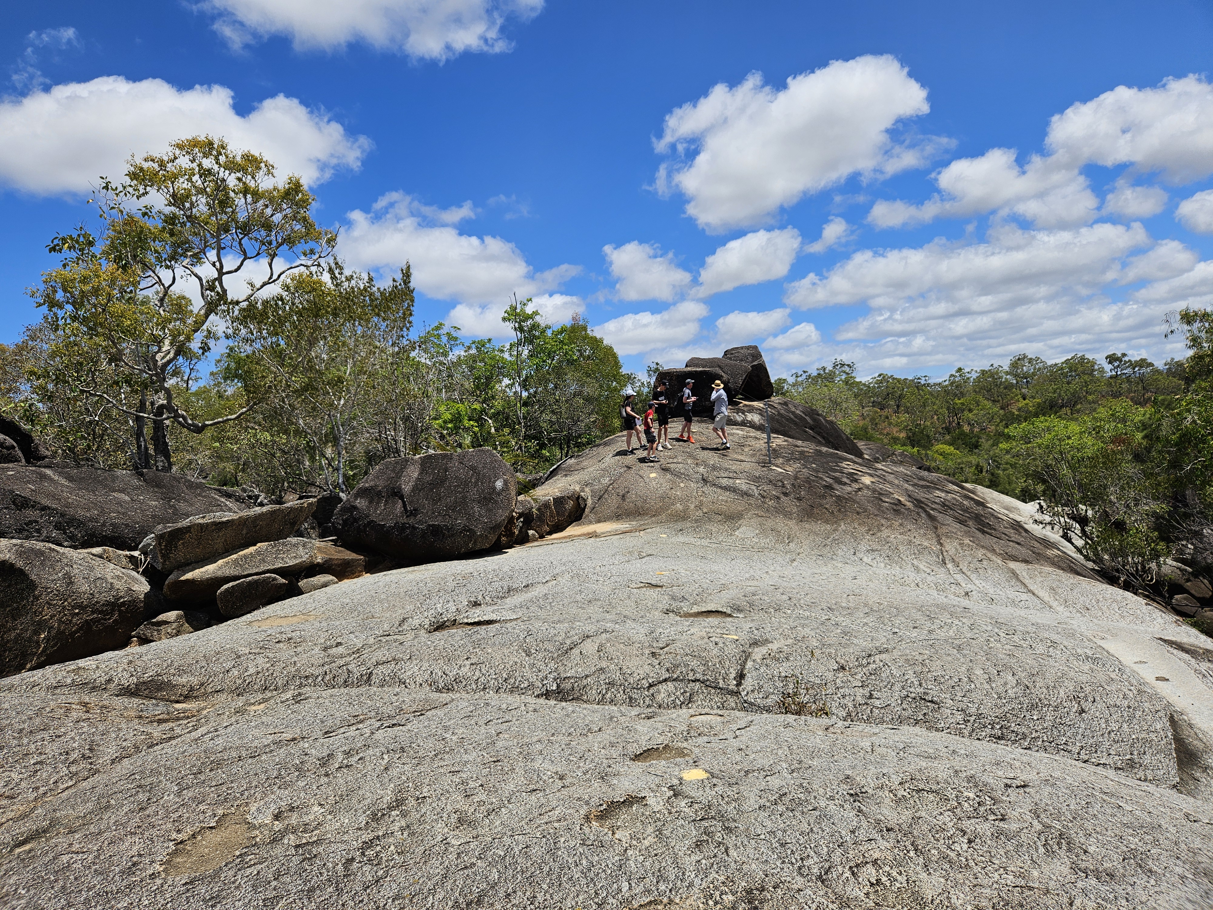 Visitors walking on granite boulders at Granite Gorge