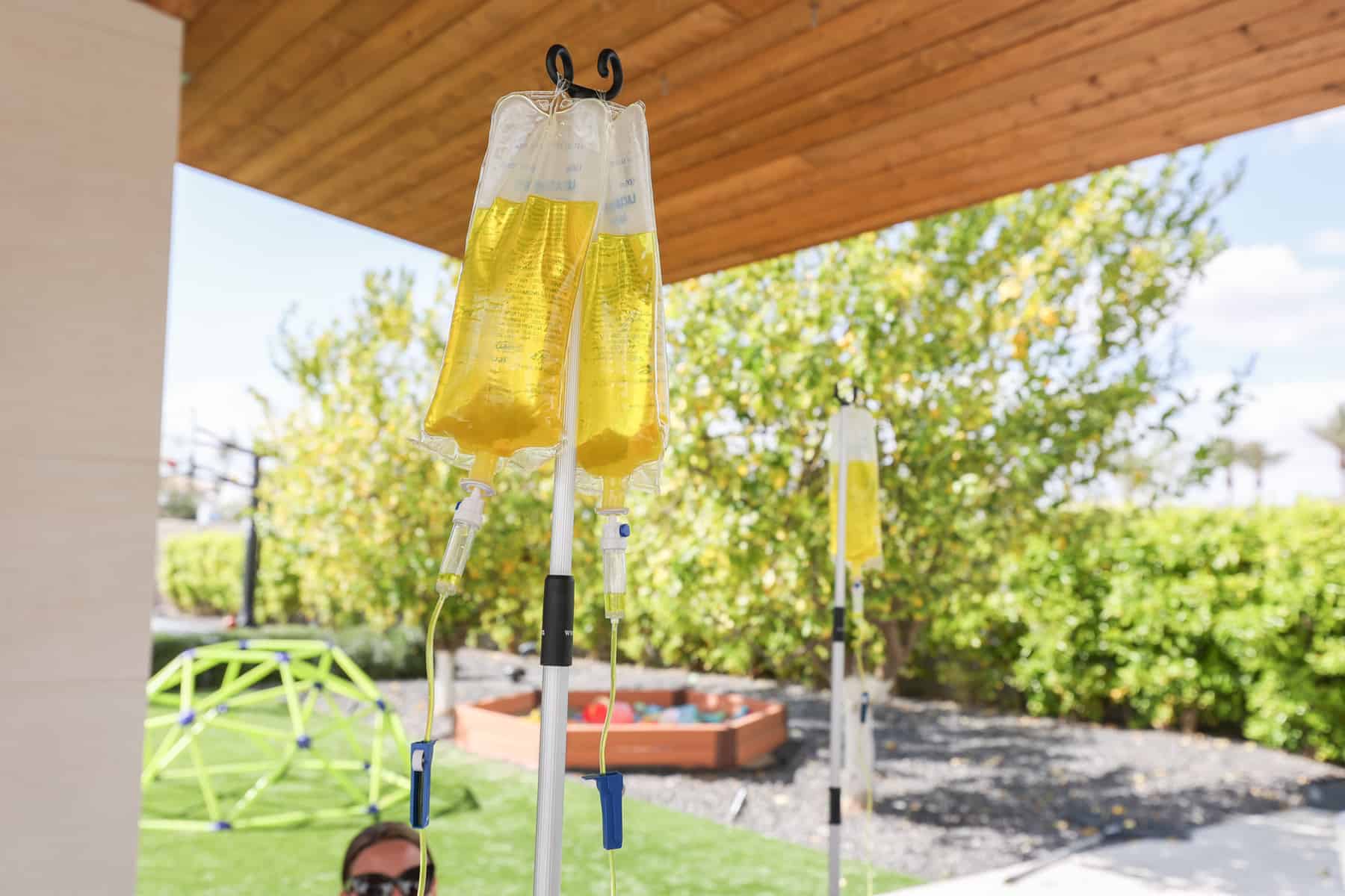 Outdoor IV drip setup under patio.