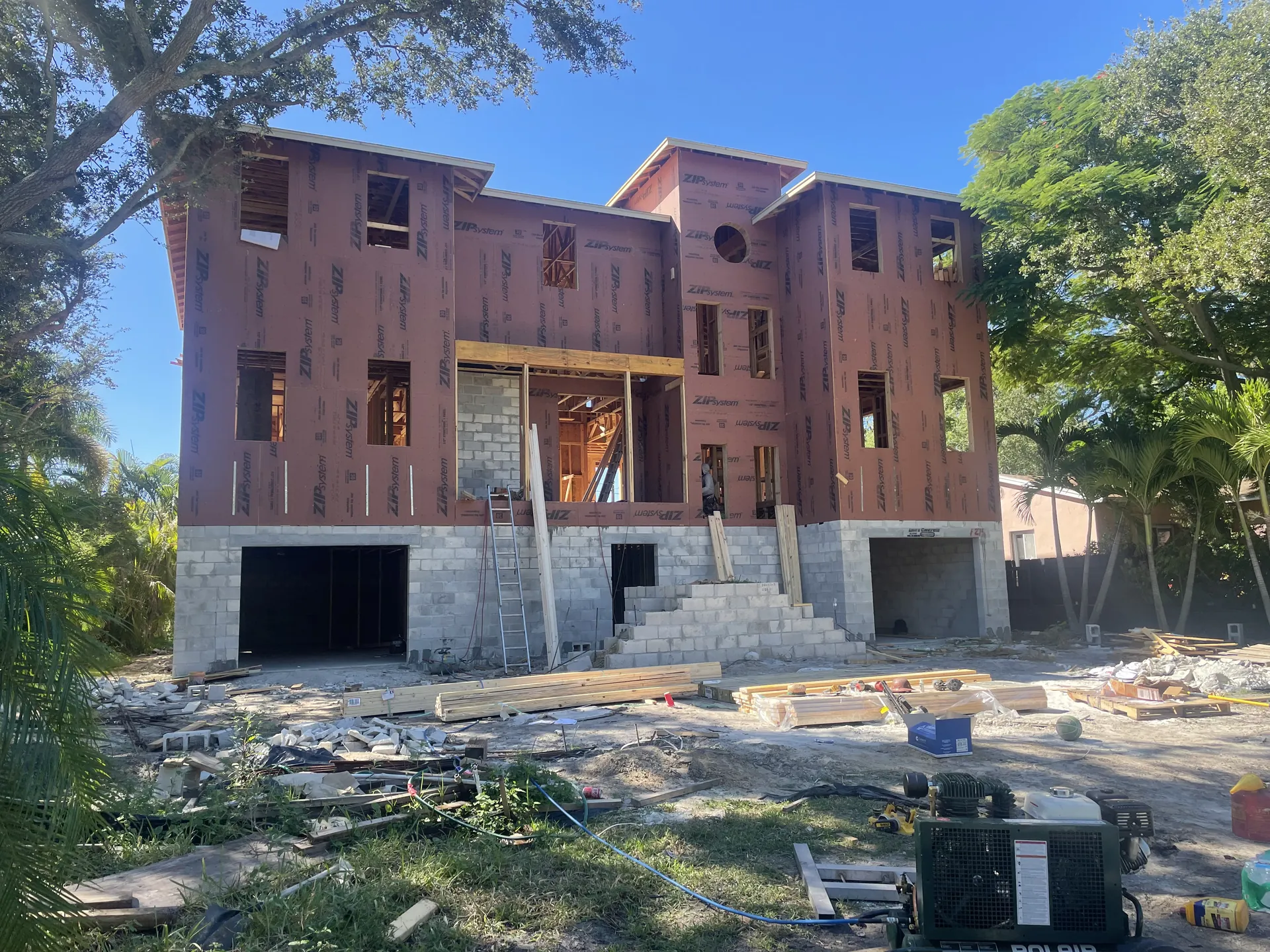 Elevated coastal residence under construction, masonry base with wood framing