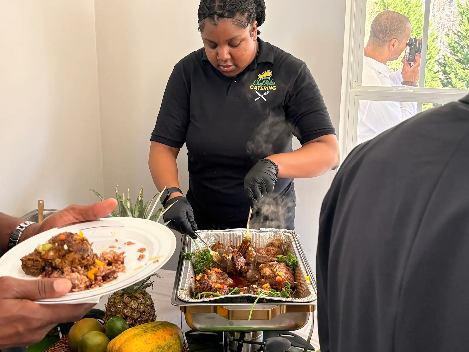 Chef Mike and his team serving guests at a catered event