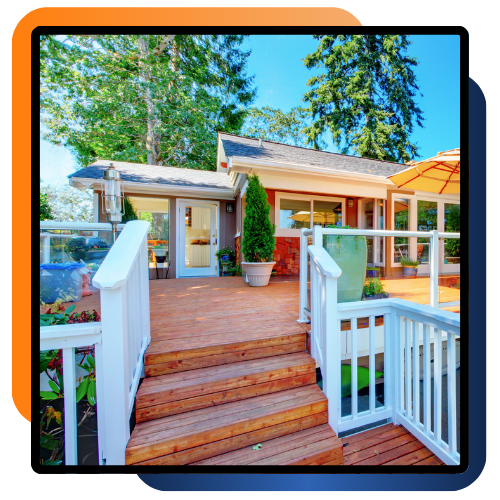 Custom wood deck behind a Catonsville home with seating space and clean railings