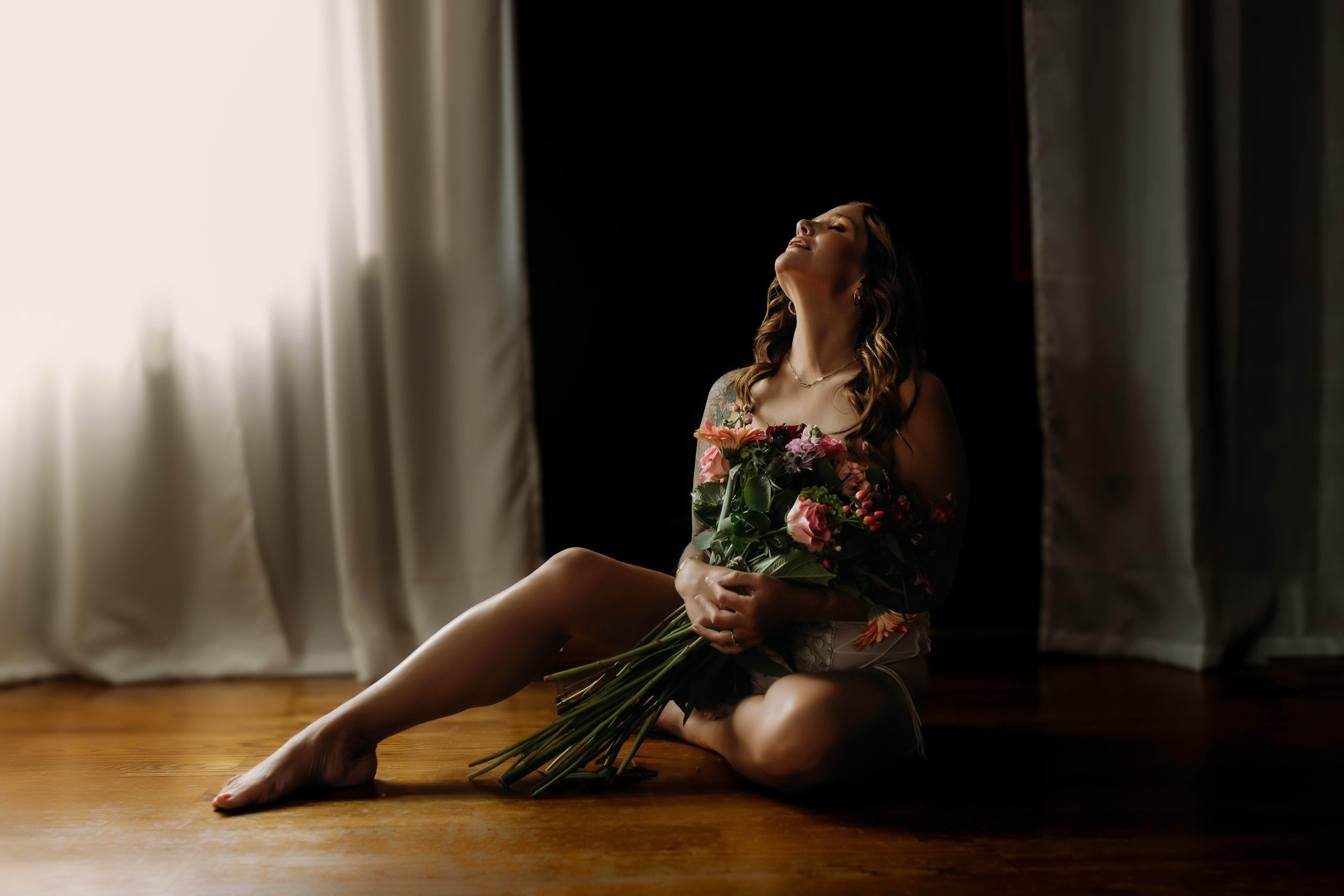 Florals boudoir studio environment with dark romantic flower styling