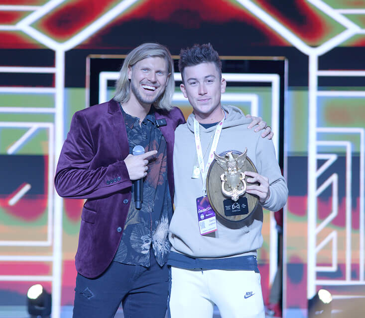 Sam on stage with Golden Door winner