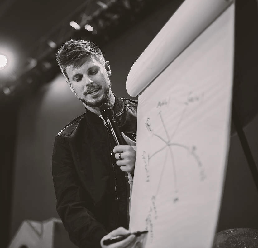 Sam Taggart teaching on whiteboard