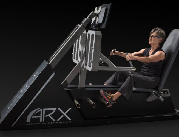 A member training on the ARX machine at LUX Fitness