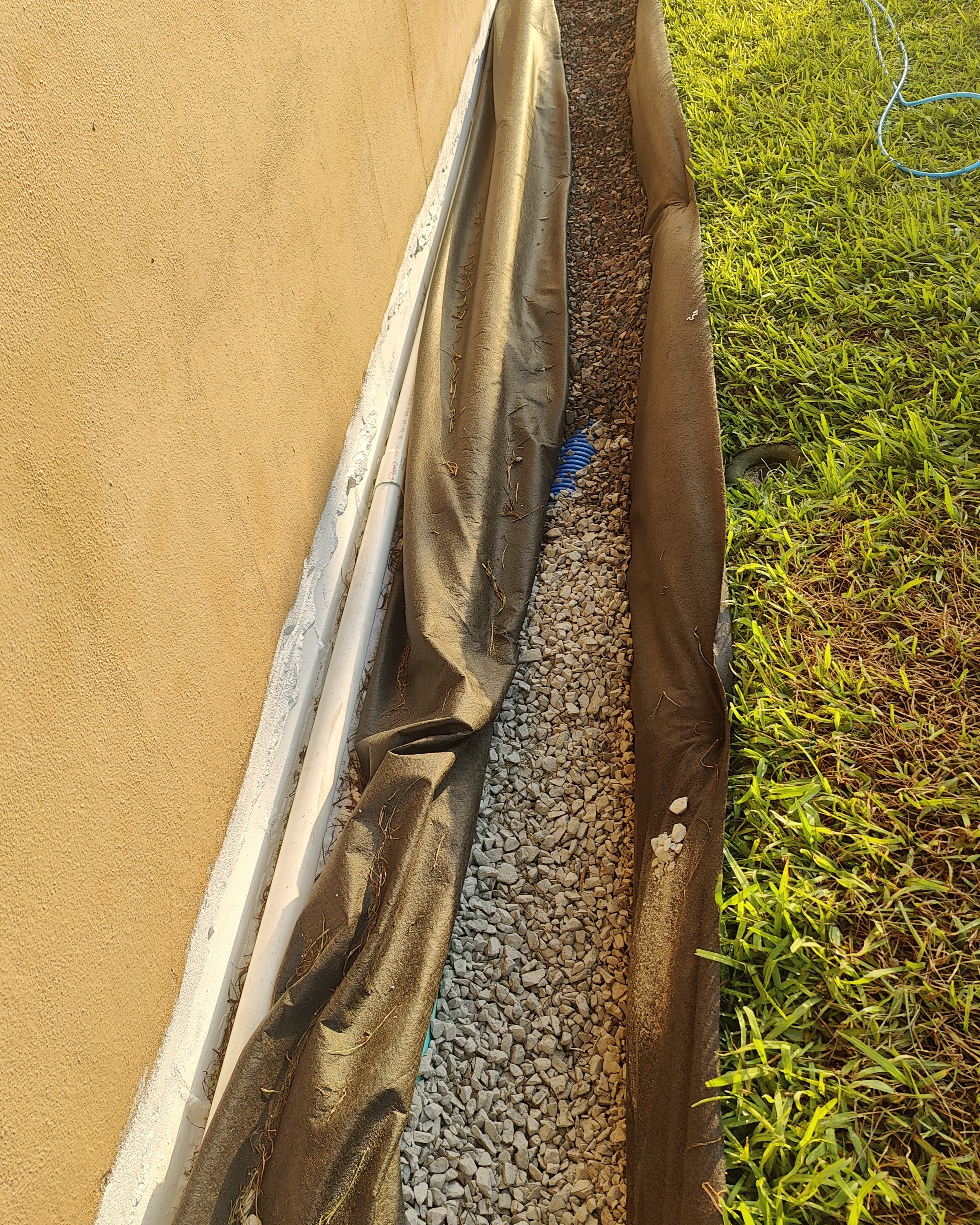 A Trufam French drain installation in a Tampa Bay yard
