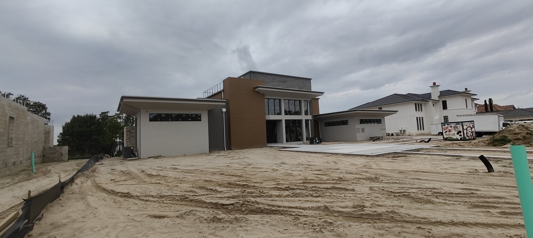 Modern luxury compound under construction in Tampa Bay where Trufam installed the gutter systems