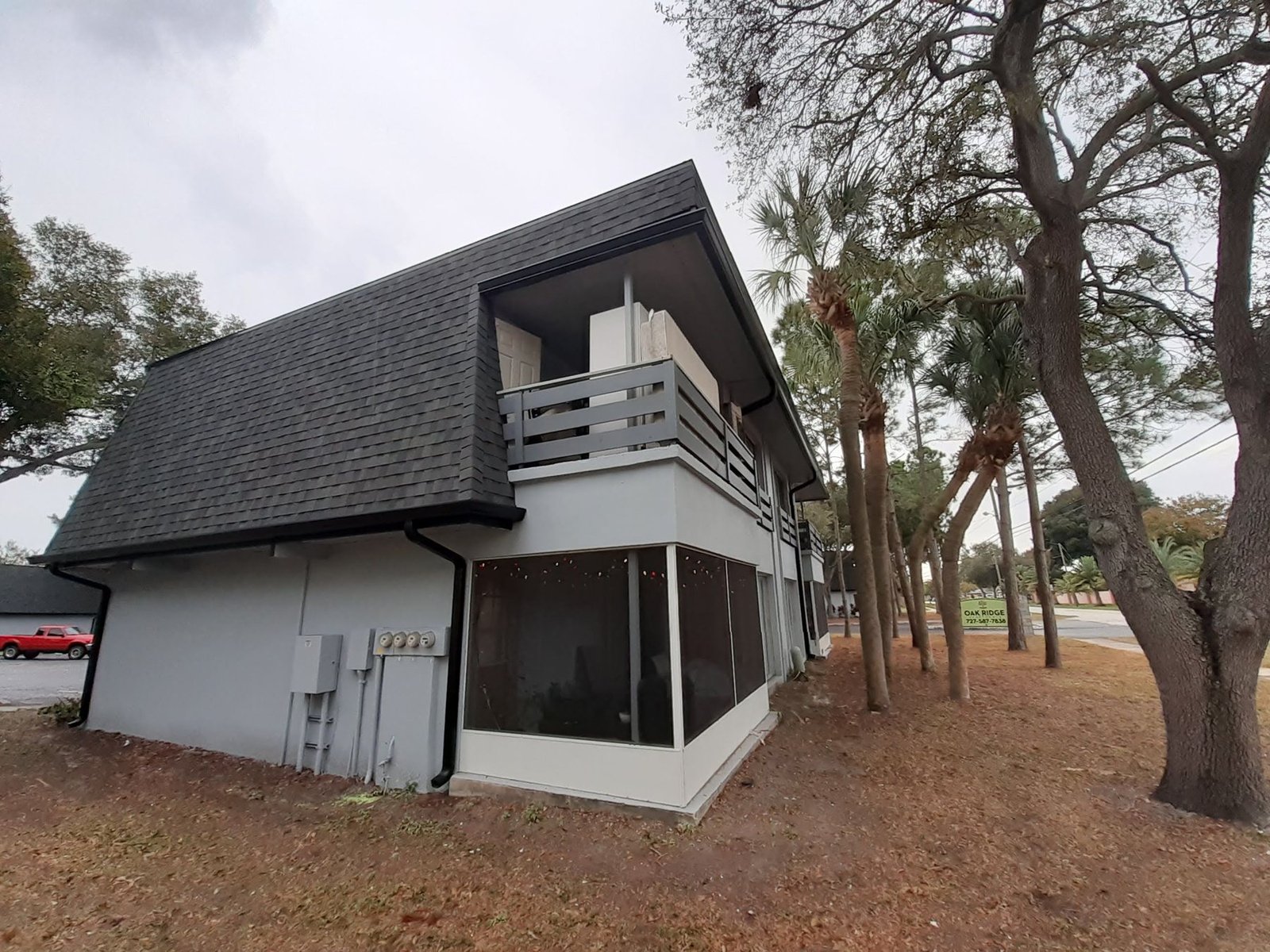 Black seamless gutters and a downspout on a two-story Tampa Bay home