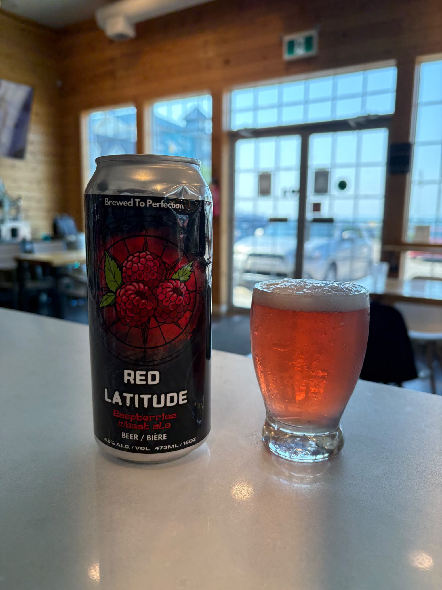 Red Latitude can and glass