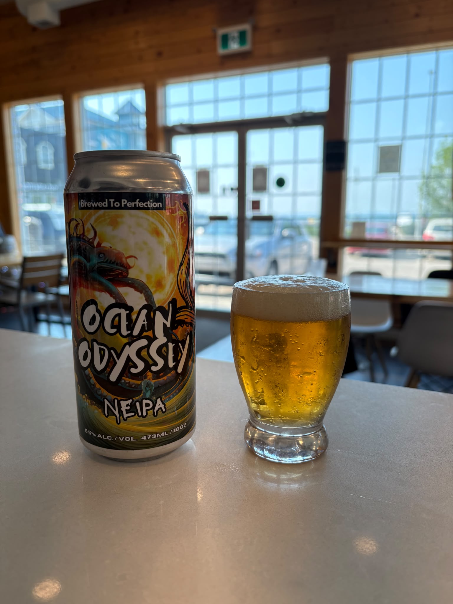 Ocean Odyssey NEIPA can and glass