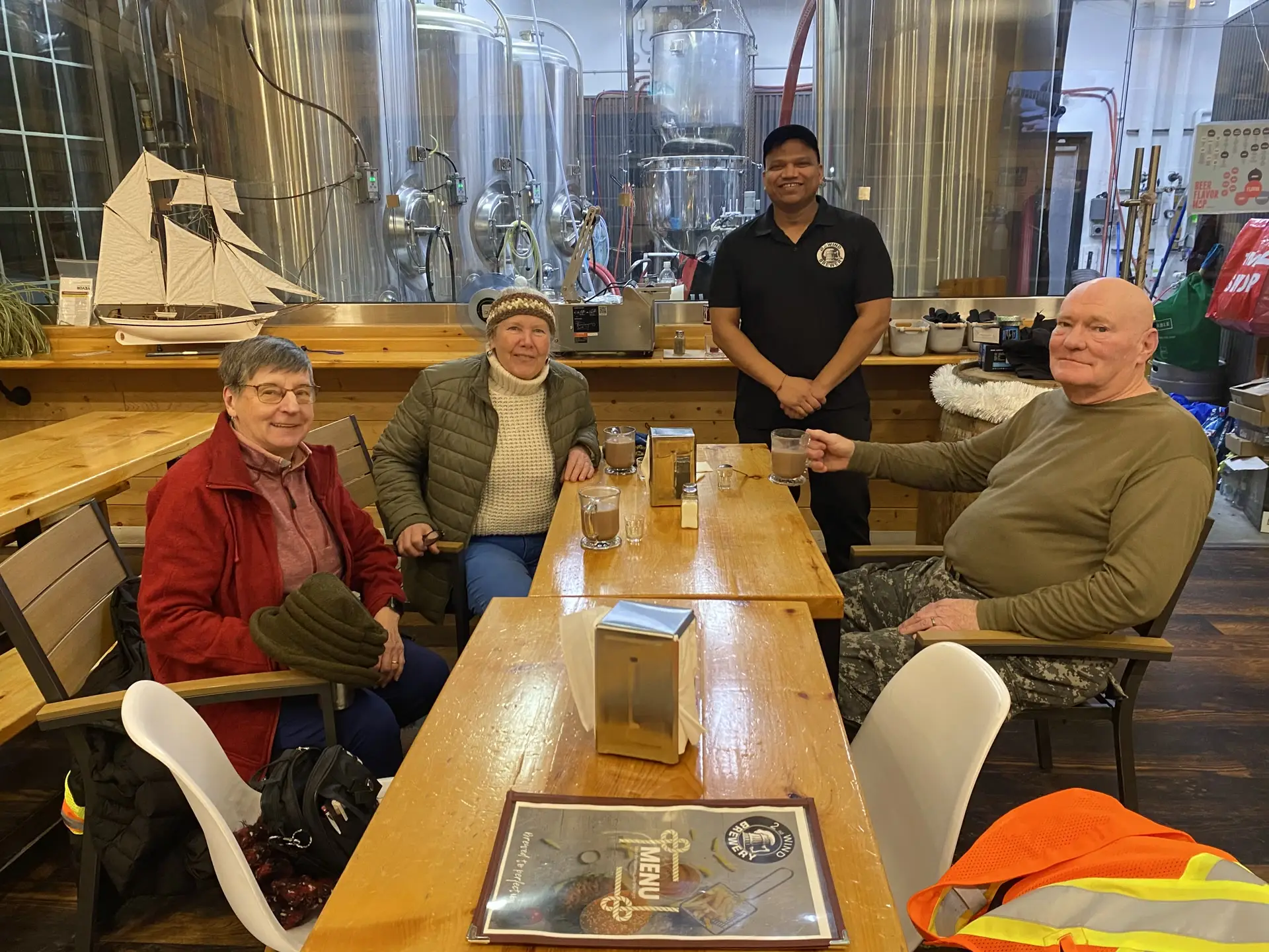 Guests at a table in the 2nd Wind taproom