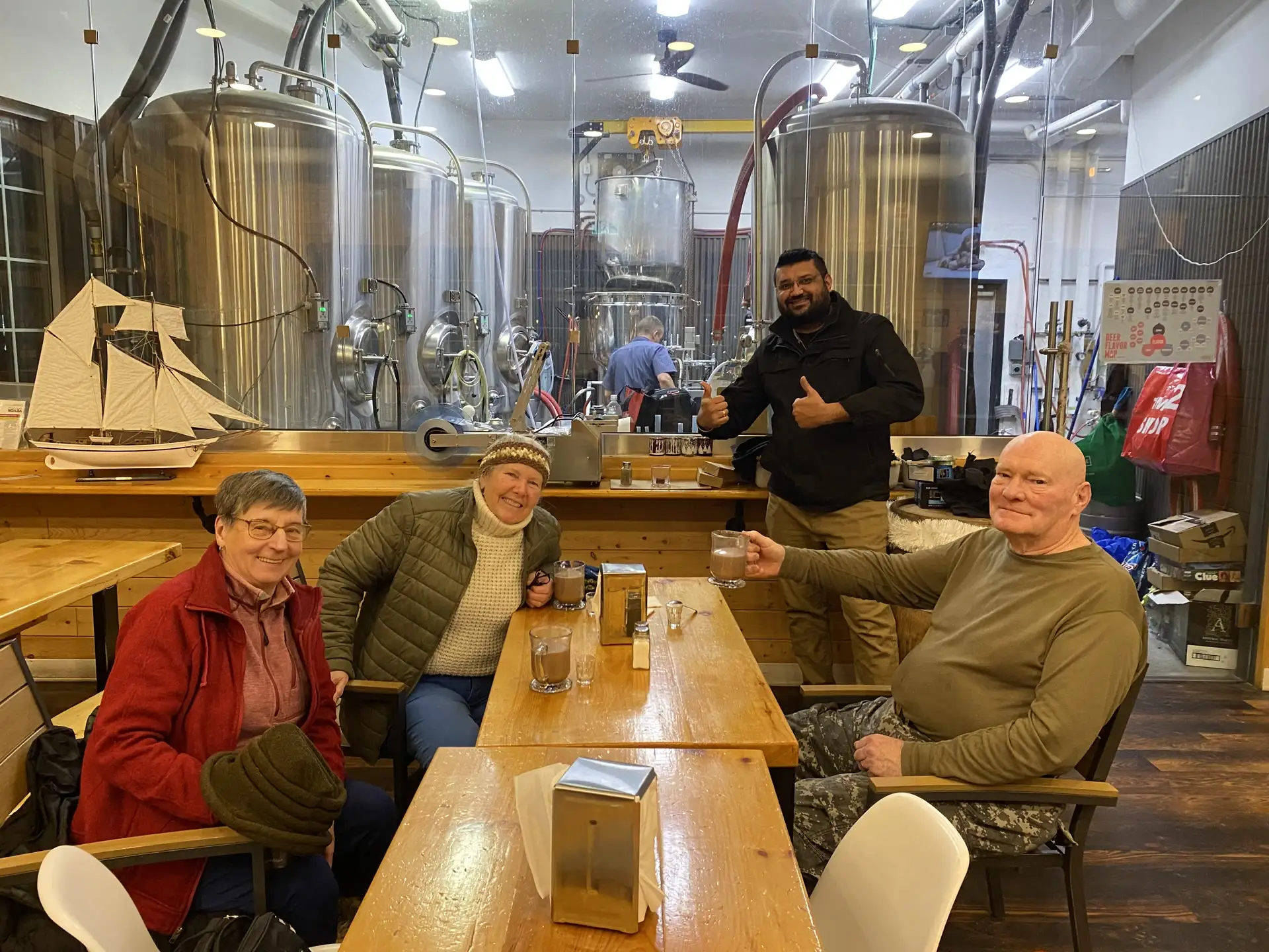 A group of guests with our staff in the 2nd Wind taproom