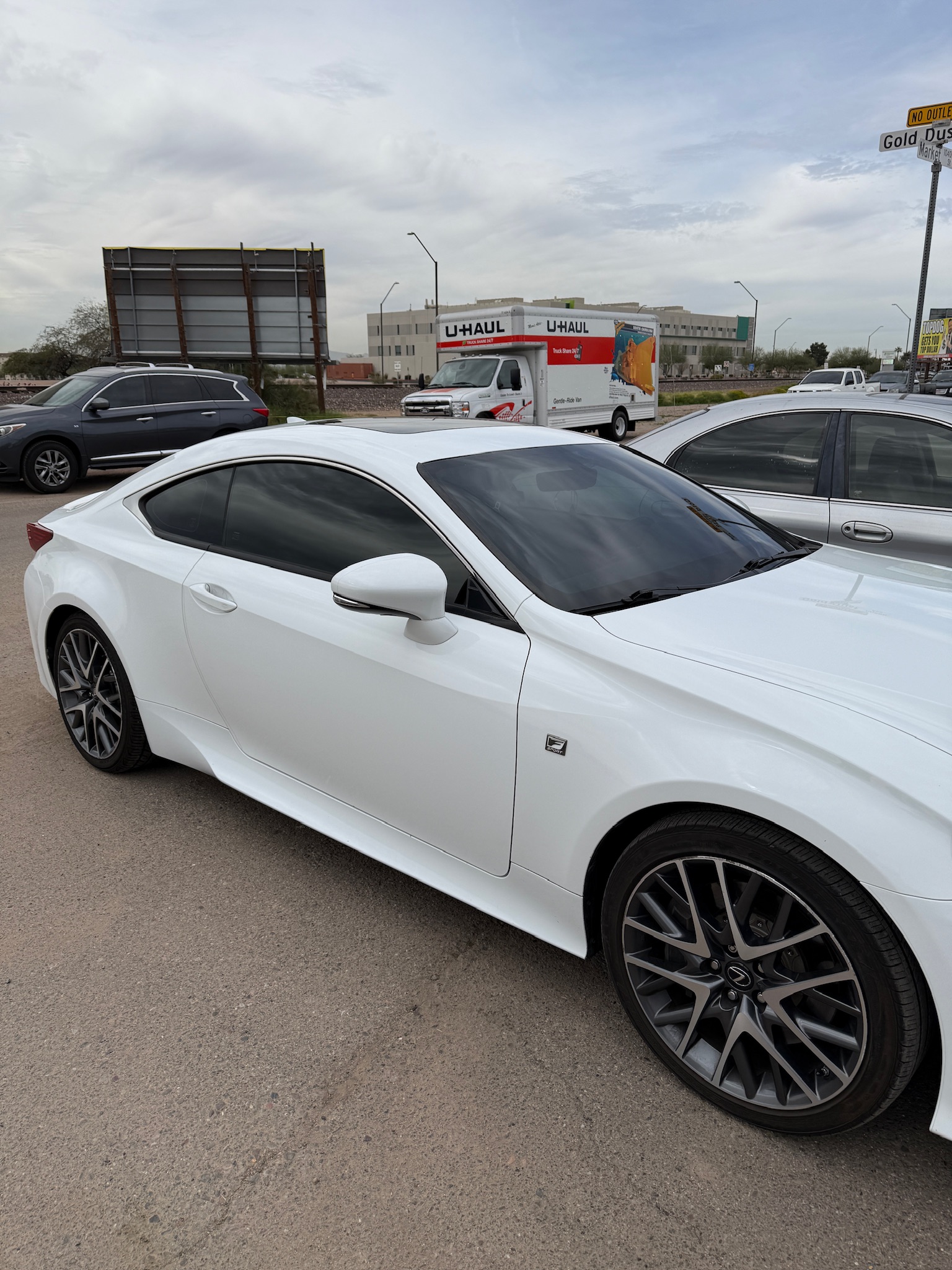 White BMW with clean window tint and wrap work at Premier Tint & Wrap