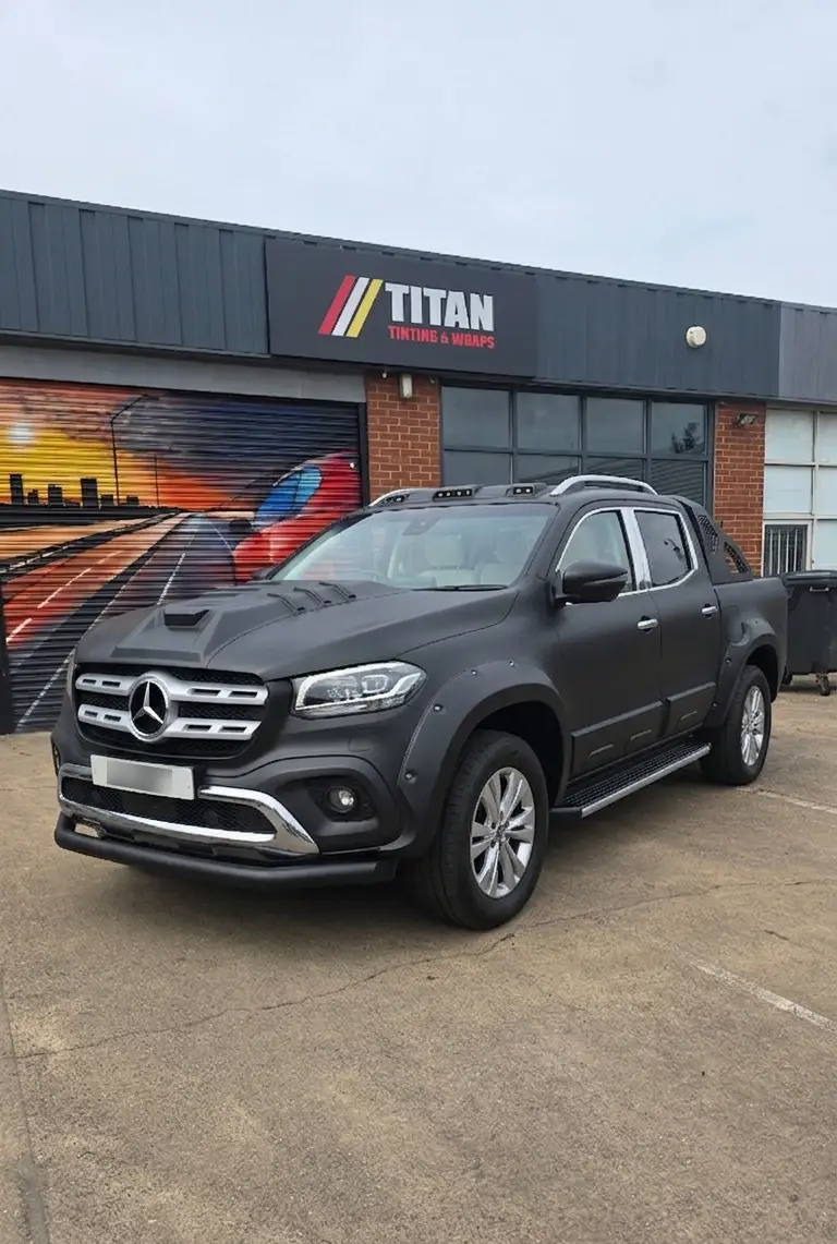 Car before the Titan blackout package - chrome trim and standard alloys