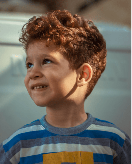 A young boy, excited to get his first eye exam