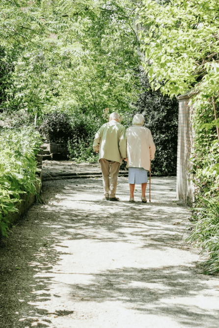 An older couple taking a walk outside on a recreational path in Sherwood Park
