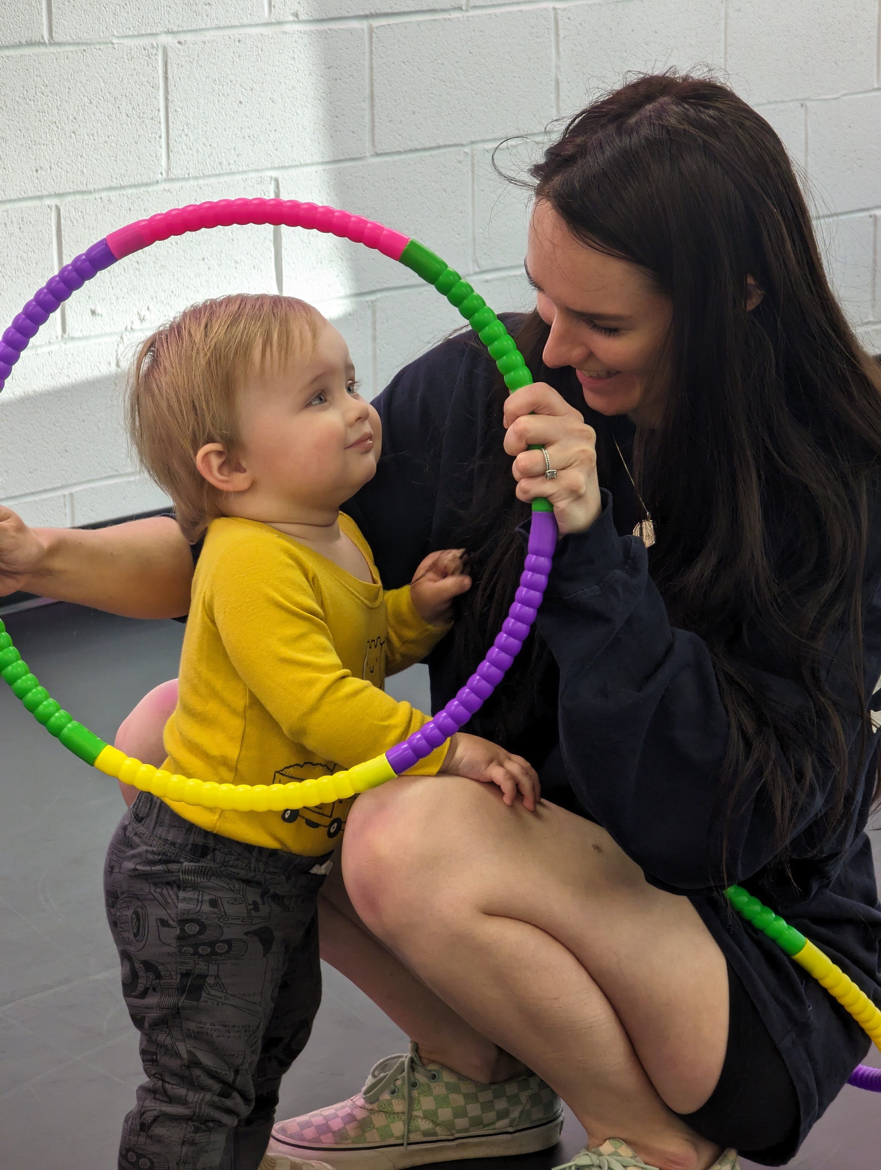 toddler and mom with hula hoop