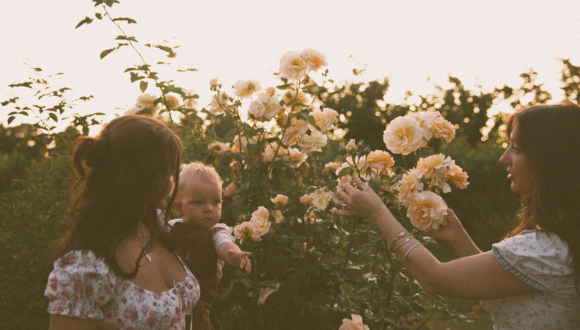 Mother and child in a garden of roses