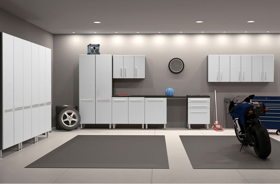 inside garage with white cabinets and gray walls