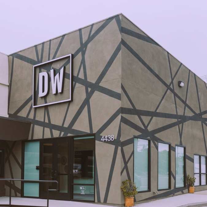The exterior and front door of Downtown Works Pacific Beach at 4438 Ingraham St