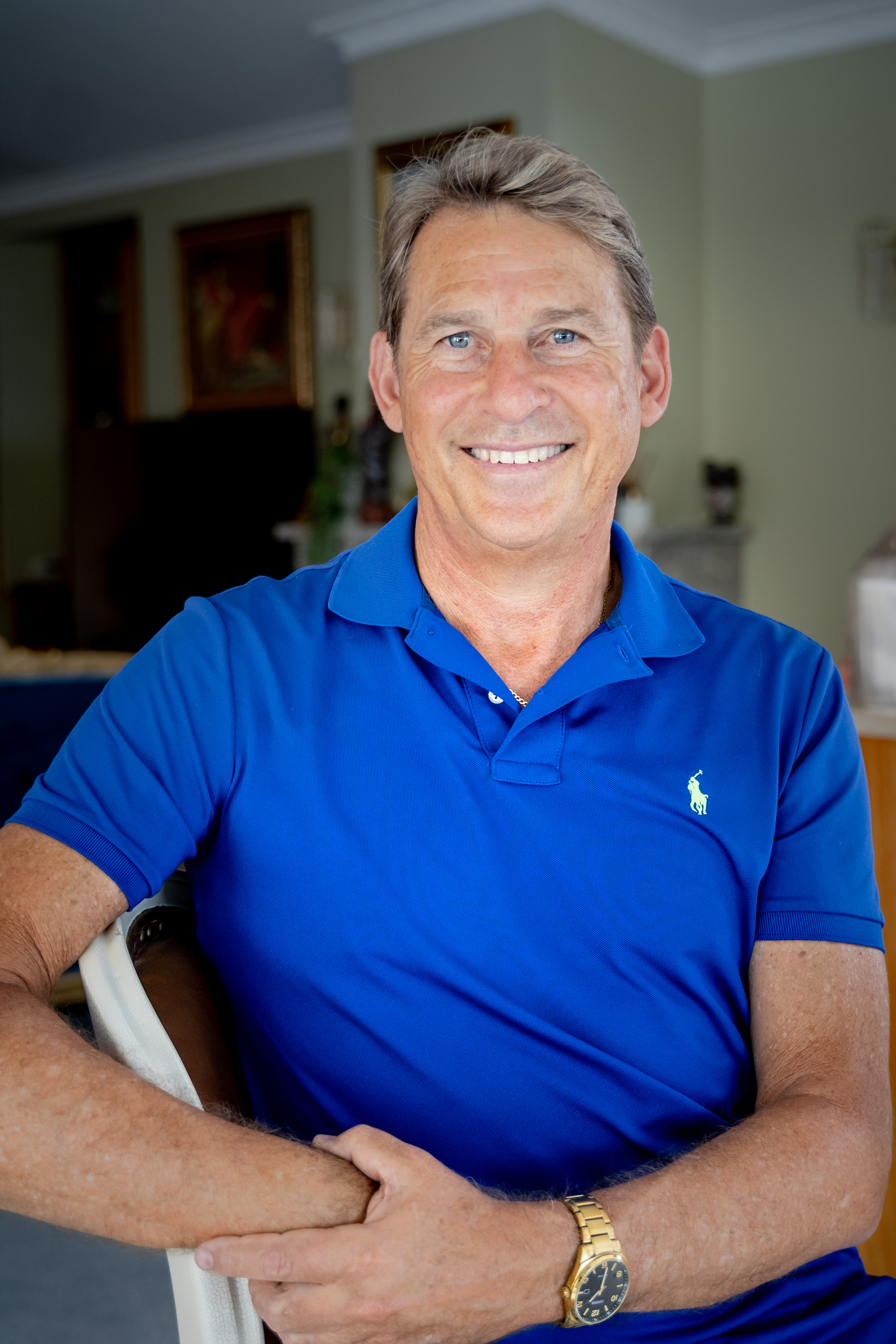 Facilitator portrait with soft, warm neutral background