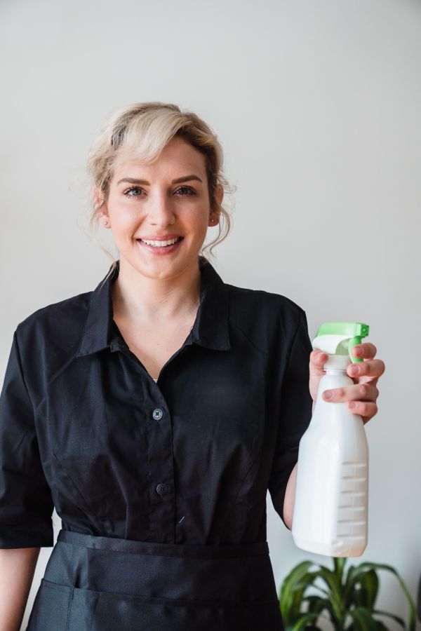 Homey Like Us professional cleaner at work in a bright NYC home